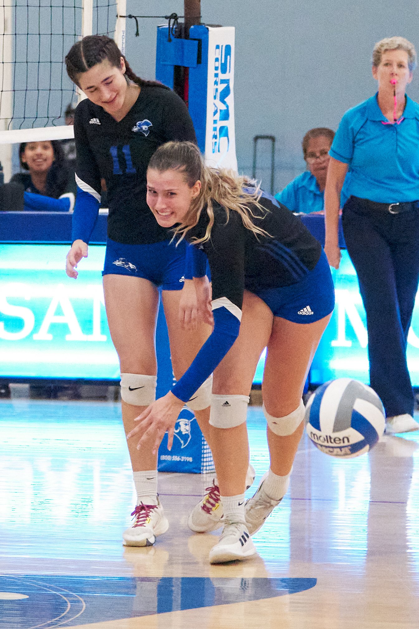  Santa Monica College Corsairs' Mia Paulson (right) fails to run through Maiella Riva (left) to reach the ball during the women's volleyball match against the Los Angeles Mission College Eagles on Friday, October 7, 2022, at the Corsair Gym in Santa 
