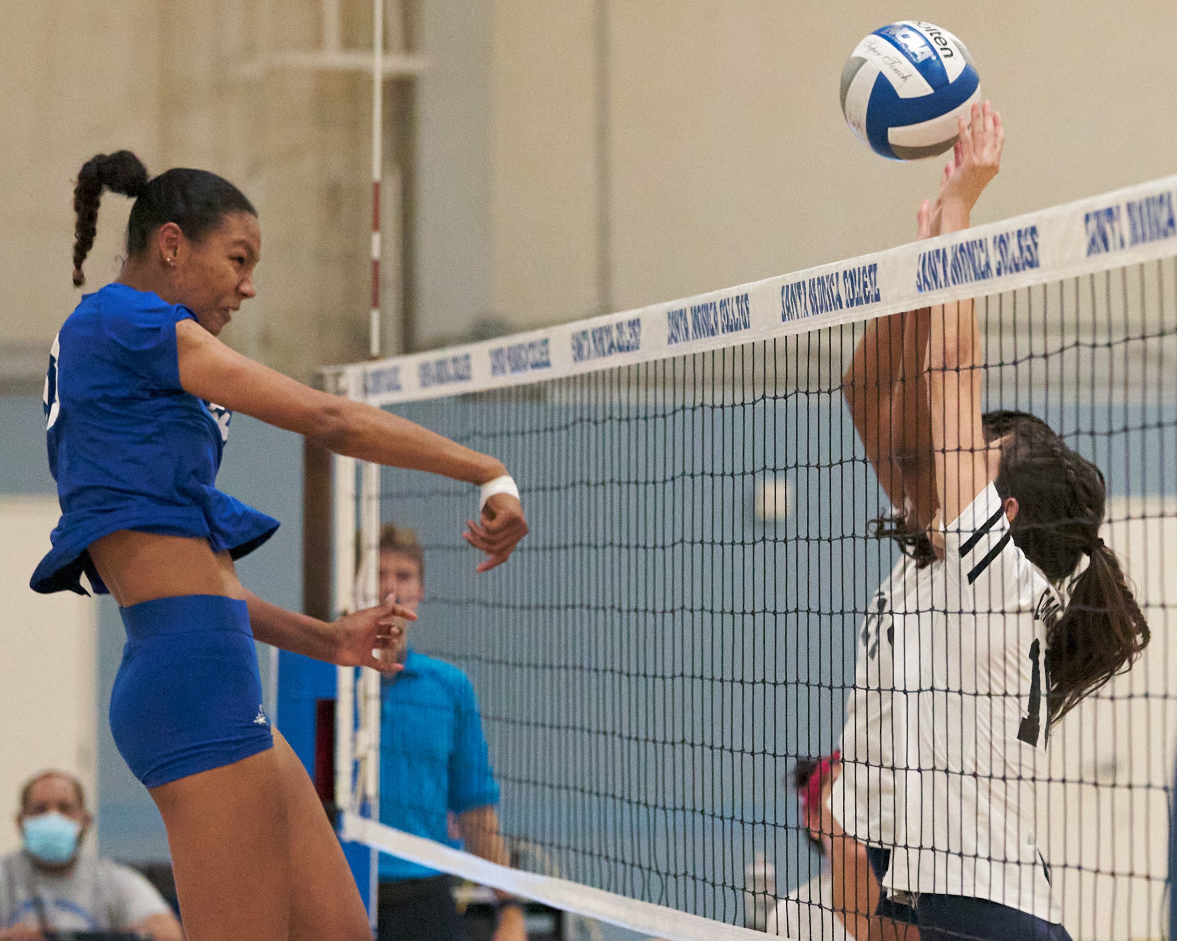  Santa Monica College Corsairs' Rain Martinez hits the ball past College of the Canyons Cougars' Sahliyah Ravare and Ariana Vargas during the women's volleyball match on Friday, Oct. 28, 2022, at SMC Gym in Santa Monica, Calif. The Corsairs lost 1-3.