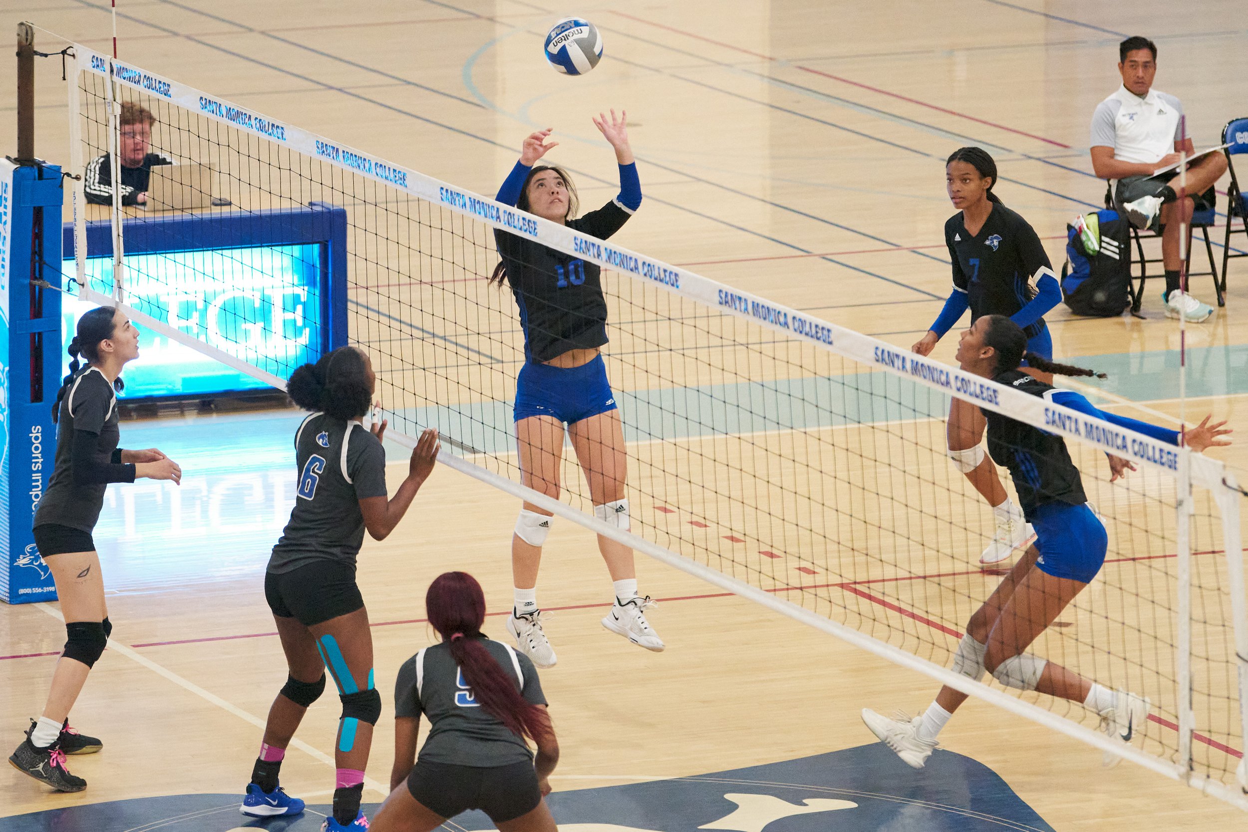  Santa Monica College Corsairs' Sophia Odle (center) sets the ball for Rain Martinez (bottom right) during the women's volleyball game against the West Los Angeles College Wildcats on Wednesday, Oct. 26, 2022, at SMC Gym in Santa Monica, Calif. The C