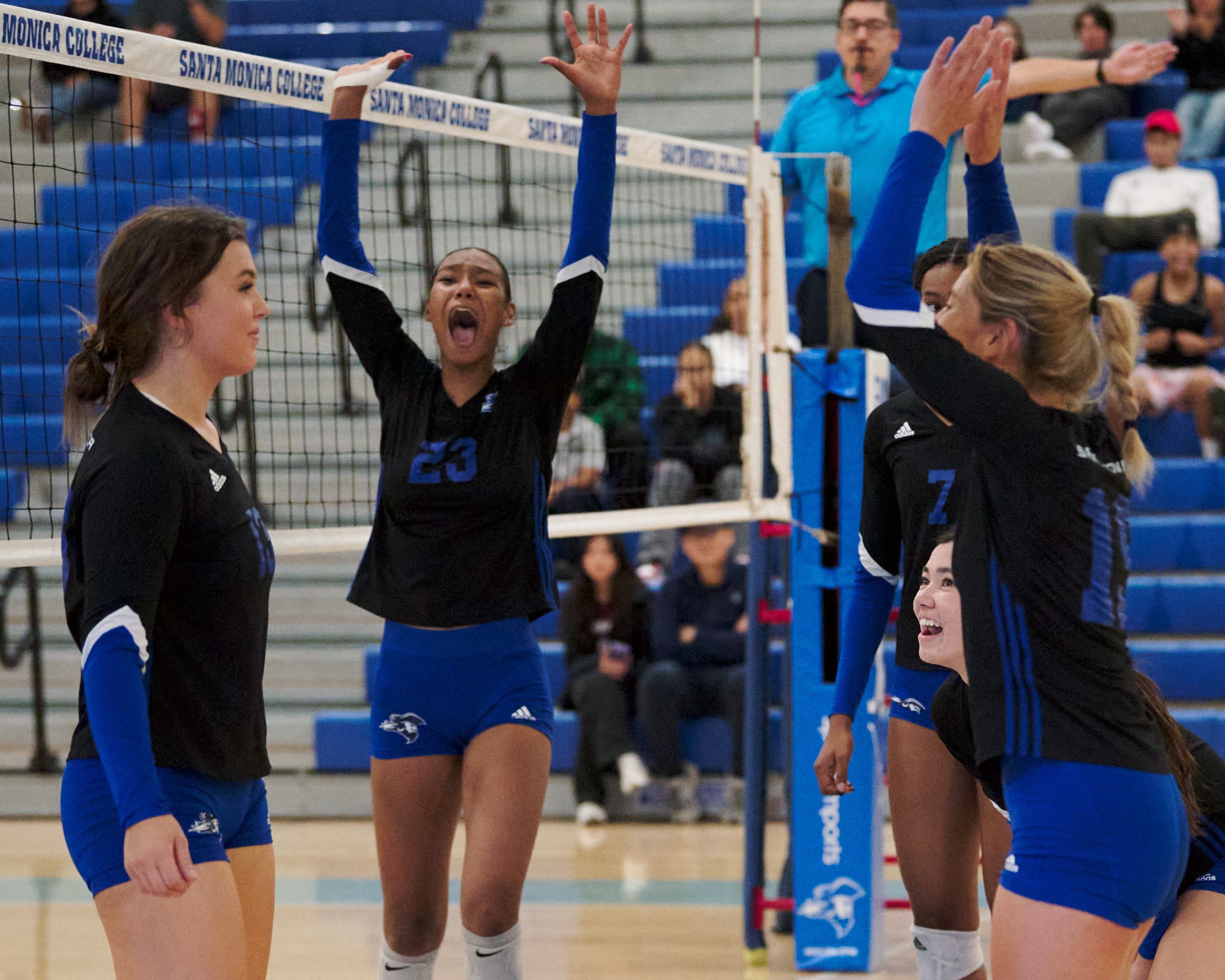 Santa Monica College Corsairs' Rain Martinez (center) and teammates celebrate after a kill by Mackenzie Wolff (left) during the women's volleyball game against the West Los Angeles College Wildcats on Wednesday, Oct. 26, 2022, at SMC Gym in Santa Mo