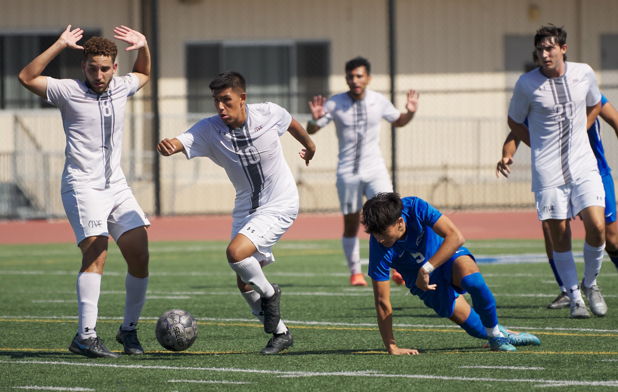  Antelope Valley College Marauders' Francisco Brasiliano, Chris Romero, Diego Chavez Torres, and Chance Shearer, and Santa Monica College Corsairs' Jose Urdiano (blue) during the men's soccer match on Friday, Sept. 30, 2022, at Corsair Field in Santa