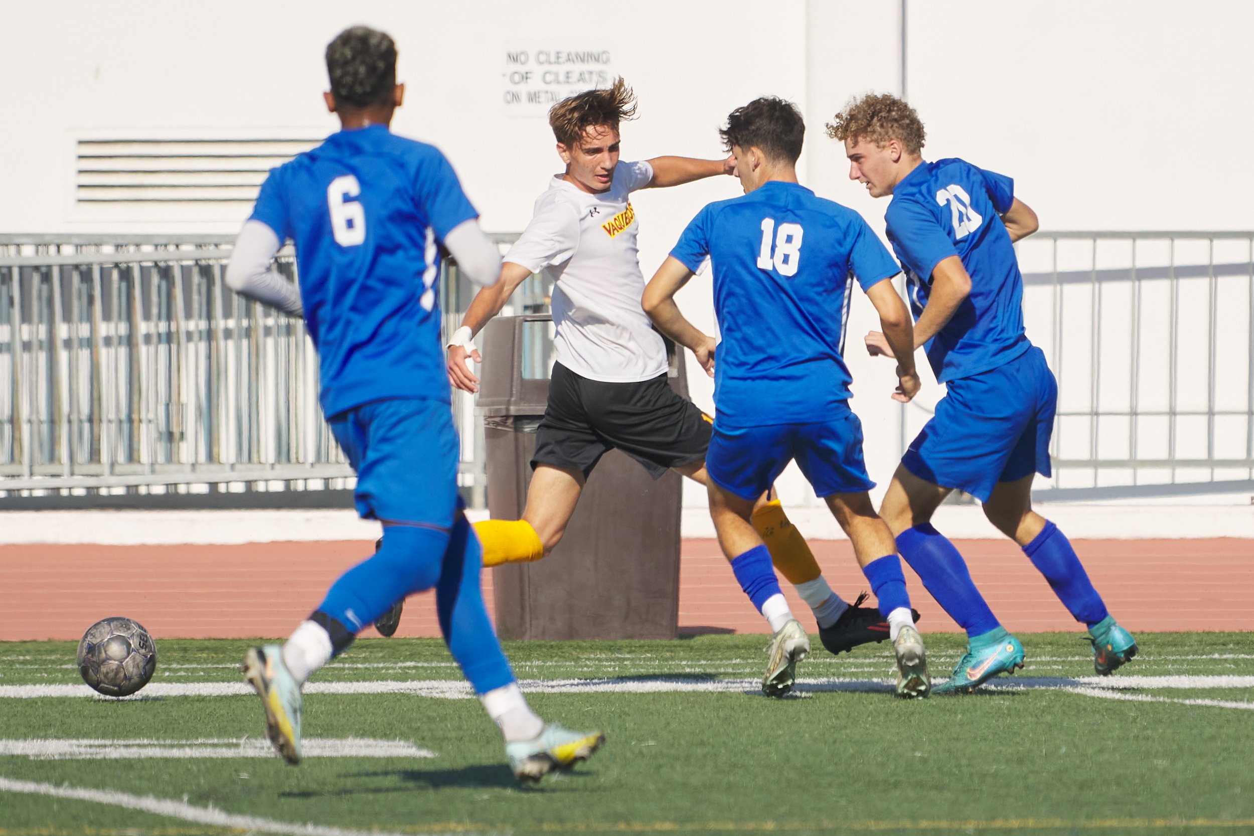  Sebastian Alvarez Luna (6), Benjamin Zygman (18), and Marcus Hevesy-Rodriguez (20, right), of the Santa Monica College Corsairs, surround Mykhailo Hrabynskyi (center), of the Glendale Community College Vaqueros, during the men's soccer match on Tues