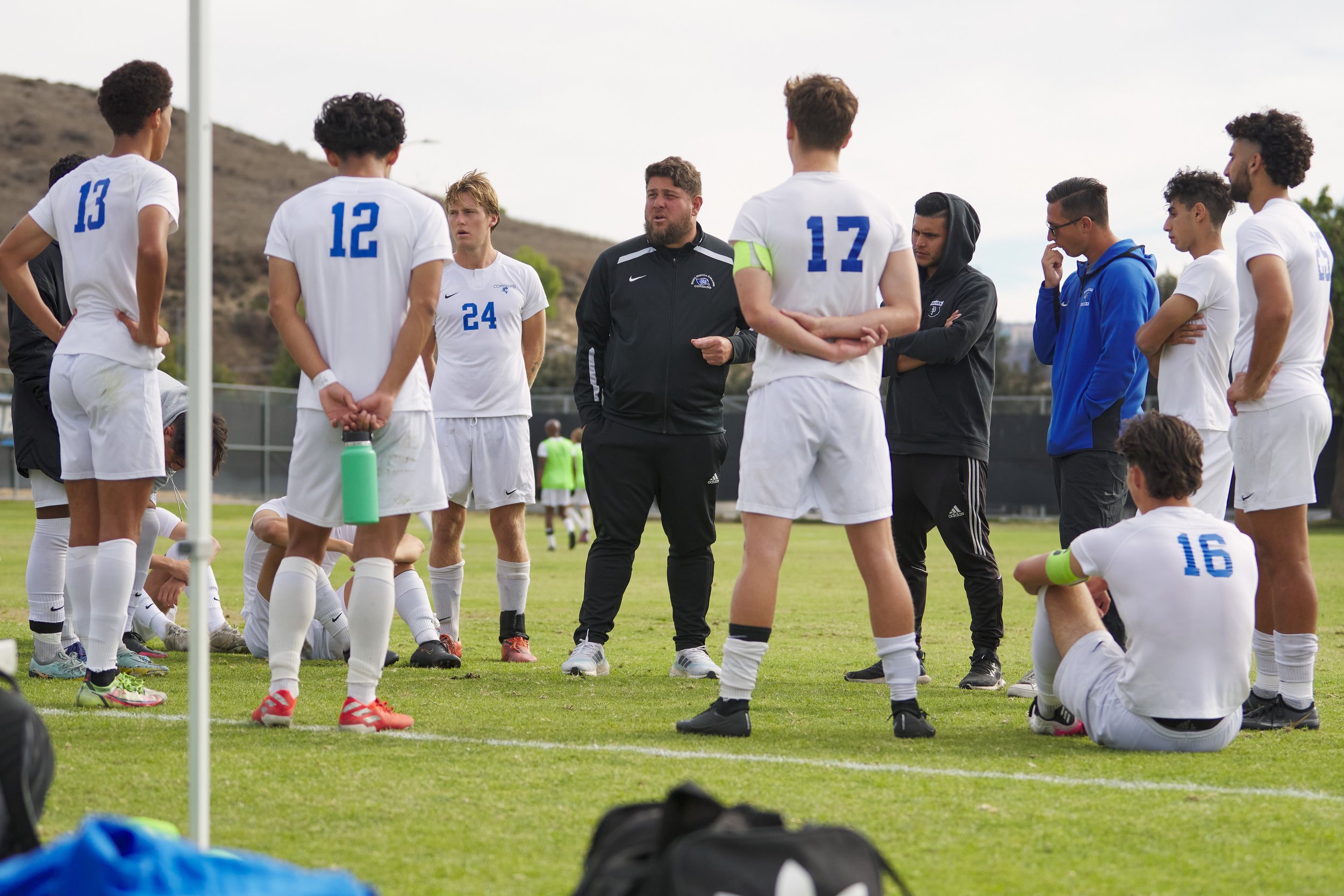  Santa Monica College Corsairs Men's Soccer Associate Head Coach Rick Minars (center) talks to the team between periods during the men's soccer match against the Moorpark College Raiders on Friday, Nov. 11, 2022, at Field Hockey Stadium in Moorpark, 