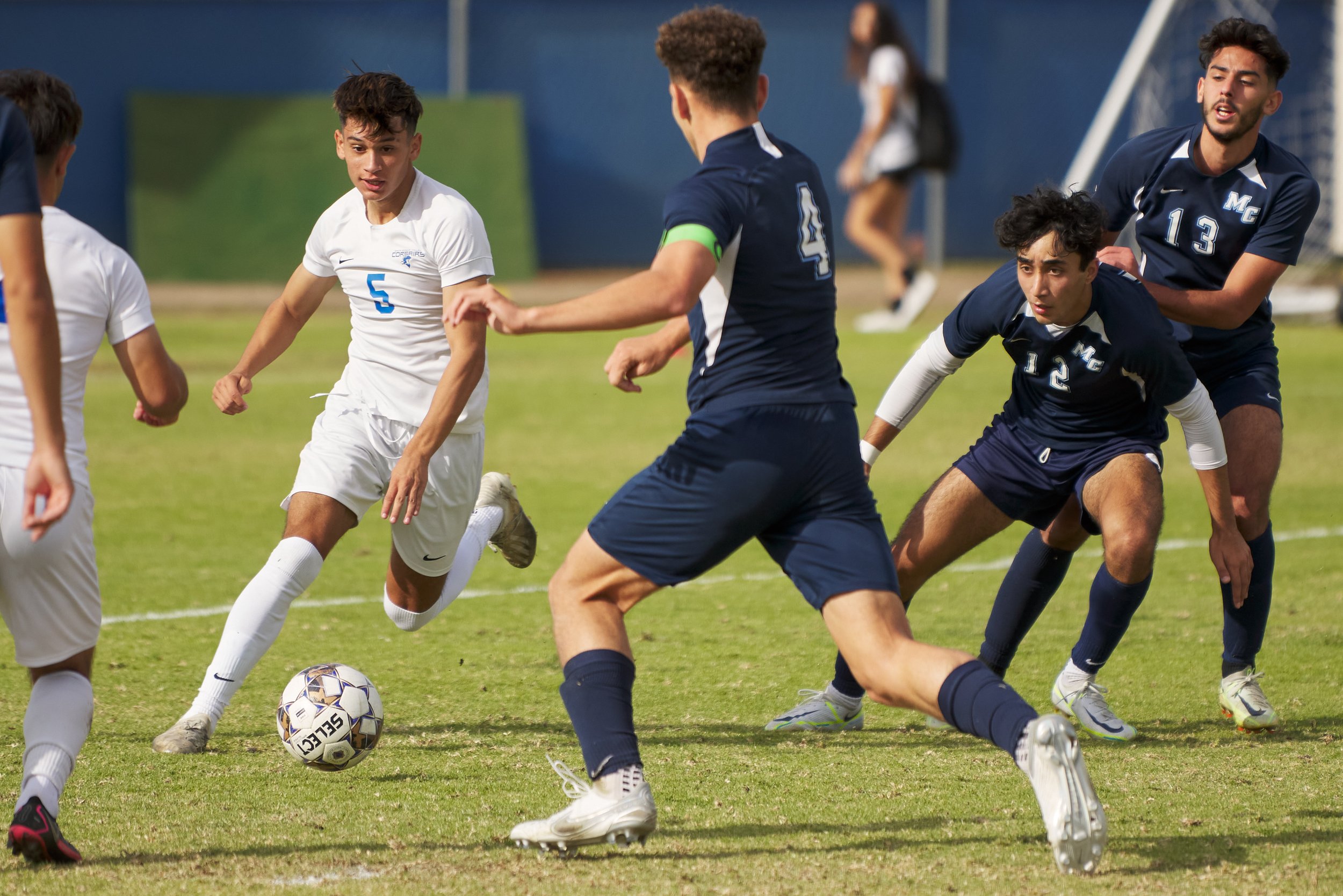  Santa Monica College Corsairs' Jose Urdiano and Moorpark College Raiders' Bagdick Bagdasaryan (4), Arjun Kaushal (12), and Marcel Kamberian (13) during the men's soccer match on Friday, Nov. 11, 2022, at Field Hockey Stadium in Moorpark, Calif. The 