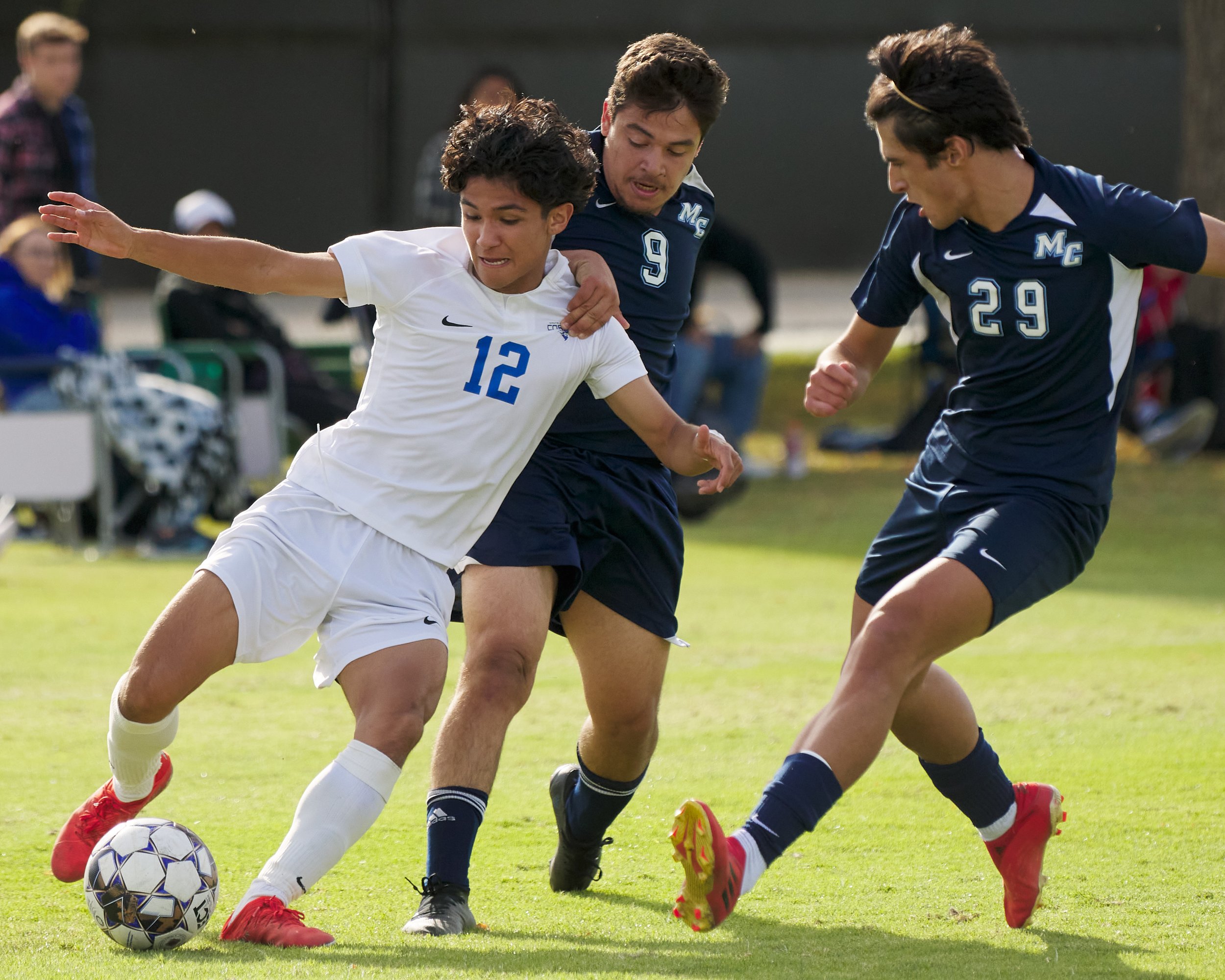  Santa Monica College Corsairs' Jason Moreno loses the ball to Moorpark College Raiders' Jonathan Rivera (29) and Jose Ricardo Chinchilla (9) during the men's soccer match on Friday, Nov. 11, 2022, at Field Hockey Stadium in Moorpark, Calif. The Cors