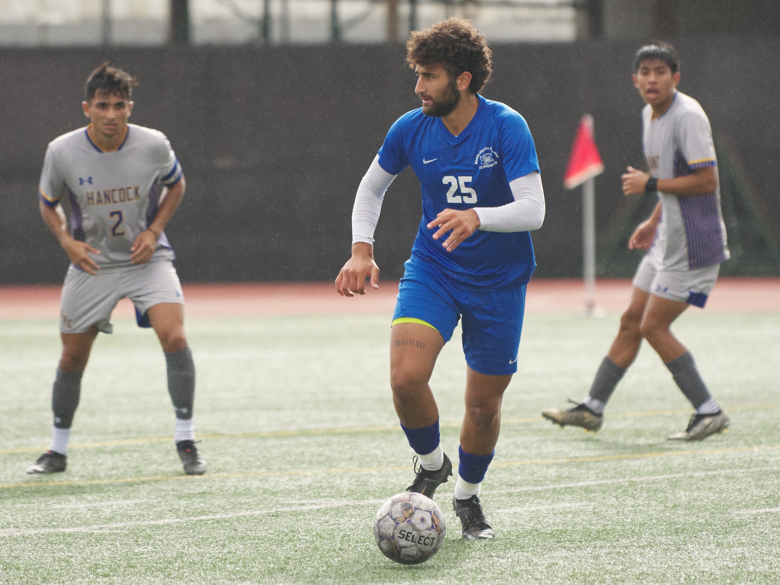  Santa Monica College Corsairs' Adam Abou-Hamad (center) and Allan Hancock College Bulldogs' Eric Diaz (left) and Oscar Monroy (right) during the men's soccer match on Tuesday, Nov. 8, 2022, at Corsair Field in Santa Monica, Calif. The Corsairs won 7