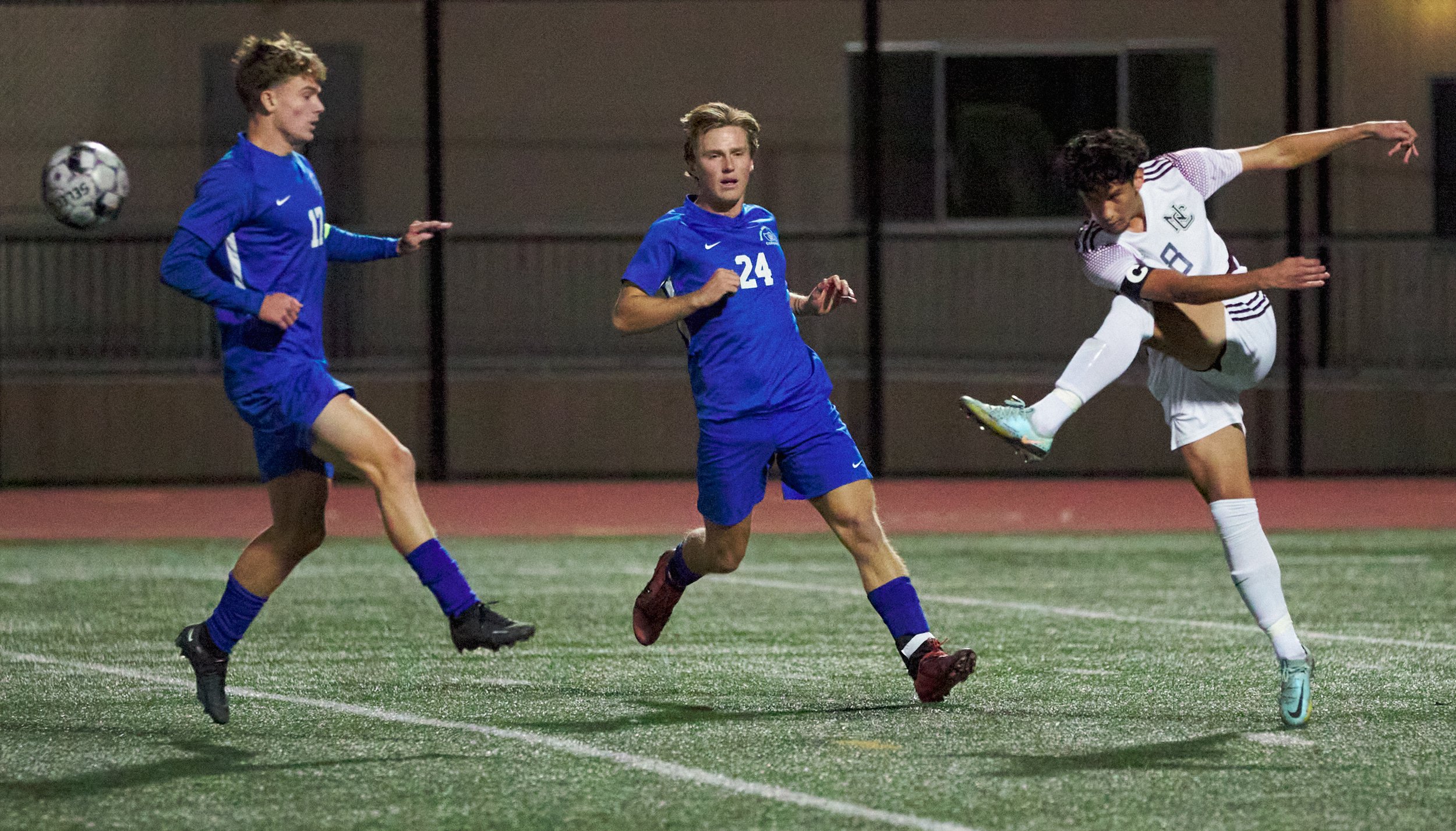  Norco College Mustangs' Cedrick Alexander (right) kicks the ball past Santa Monica College Corsairs Alexander Lalor (center) and Taj Winnard (left) during the men's soccer match on Saturday, Nov. 19, 2022, at Corsair Field in Santa Monica, Calif. (N