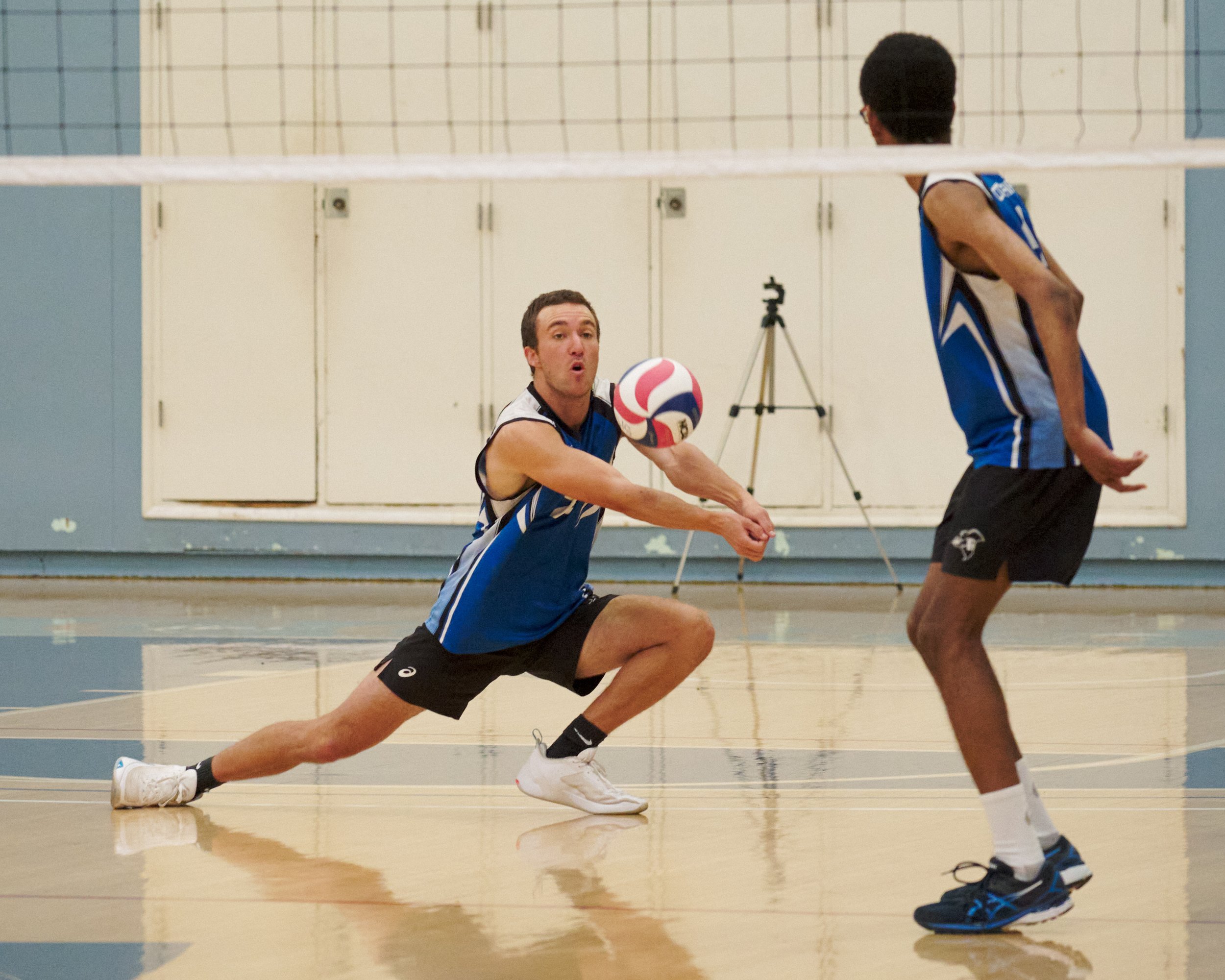  Santa Monica College Corsairs' Kane Schwengel dives for and bumps the ball during the men's volleyball match against the Grossmont College Griffins on Wednesday, Feb. 15, 2023, at Corsair Gym in Santa Monica, Calif. The Corsairs won 3-0. (Nicholas M