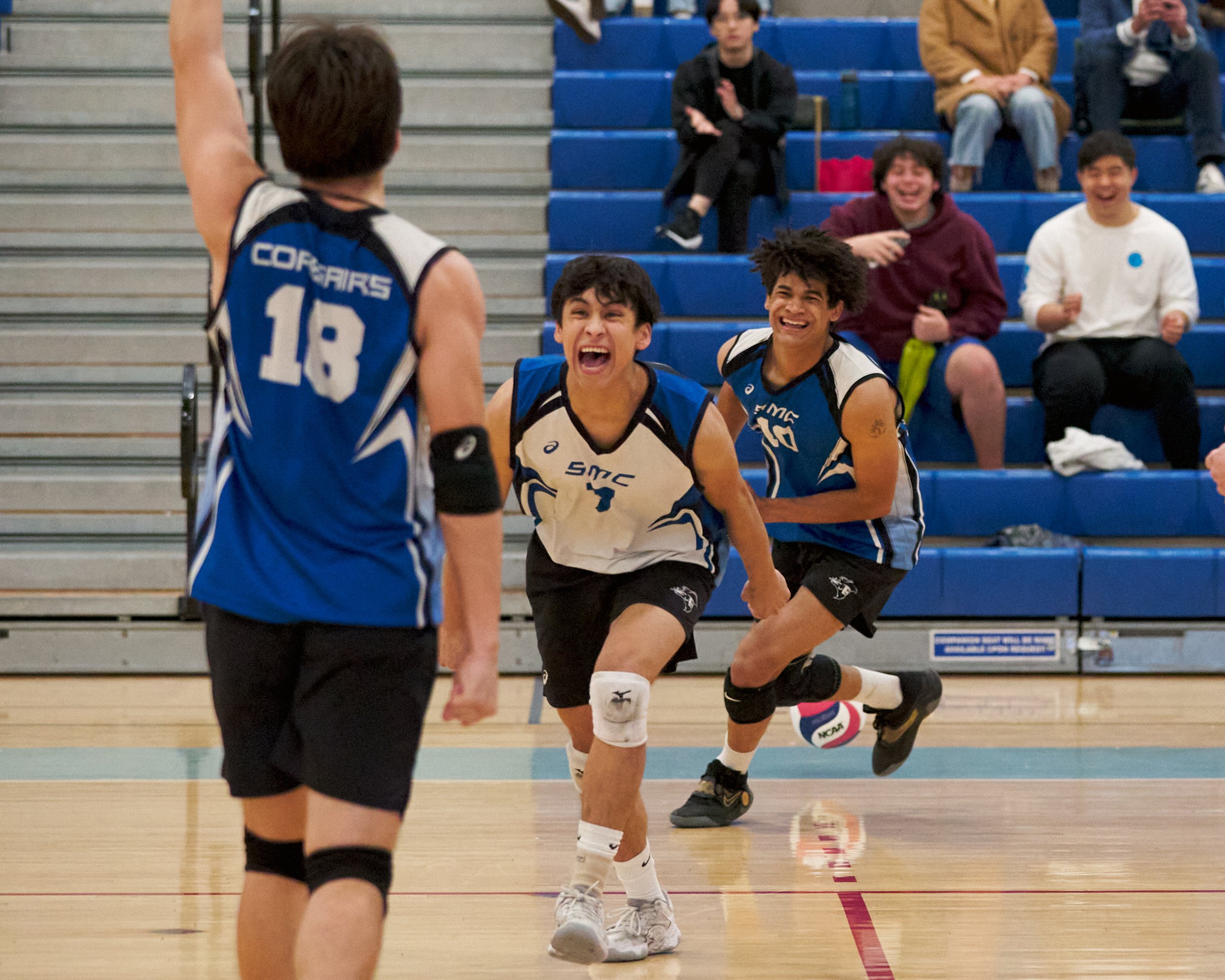  Santa Monica College Corsairs' Enkhtur Tserendavaa, Javier Castillo, and Nate Davis celebrate after scoring during the men's volleyball match against the Irvine Valley College Lasers on Friday, Feb. 24, 2023, at Corsair Gym in Santa Monica, Calif. T