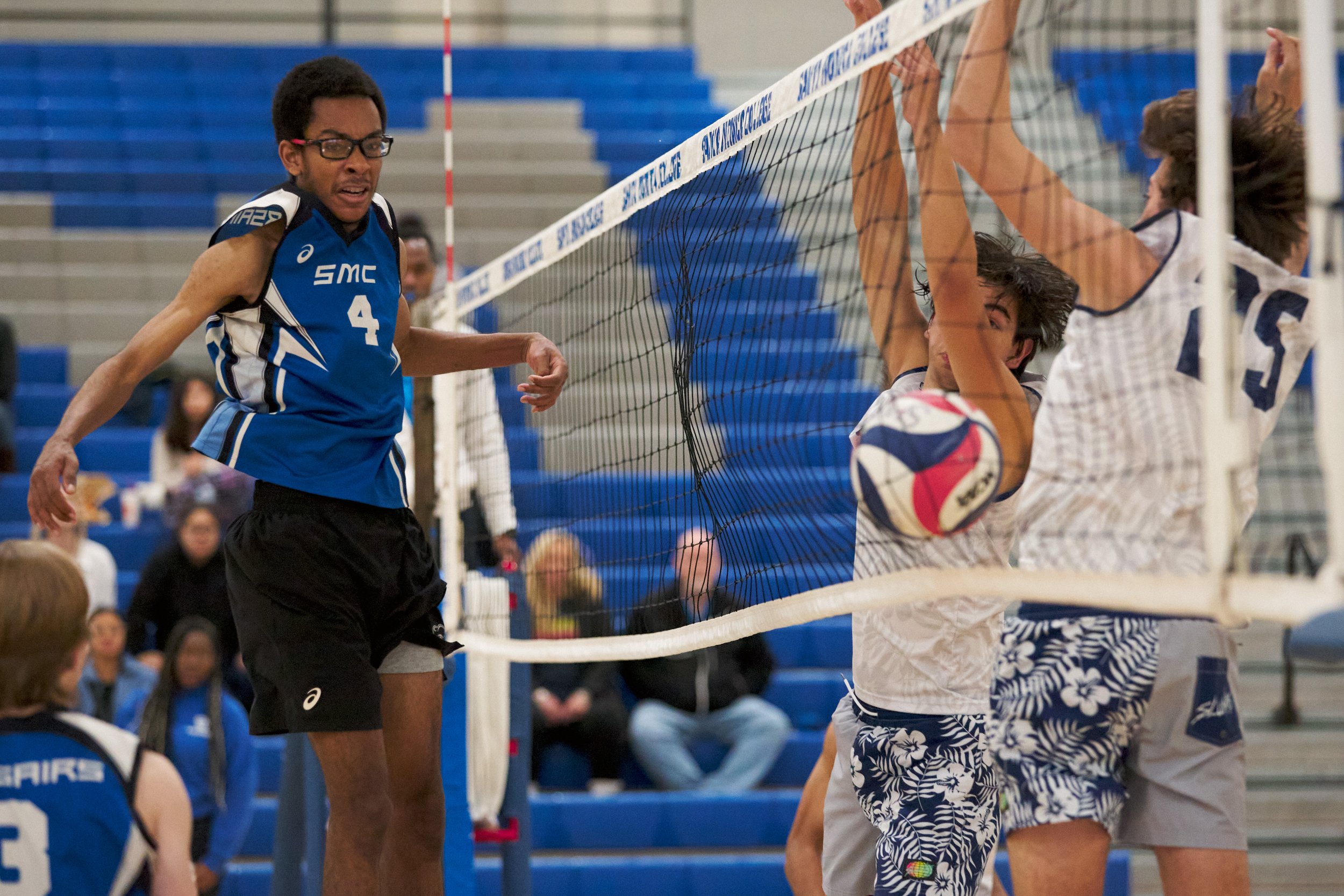  Santa Monica College Corsairs' Beikwaw Yankey scores by sending the ball between the net and Irvine Valley College Lasers' Julio Gutierrez and Jared Irwin during the men's volleyball match on Friday, Feb. 24, 2023, at Corsair Gym in Santa Monica, Ca