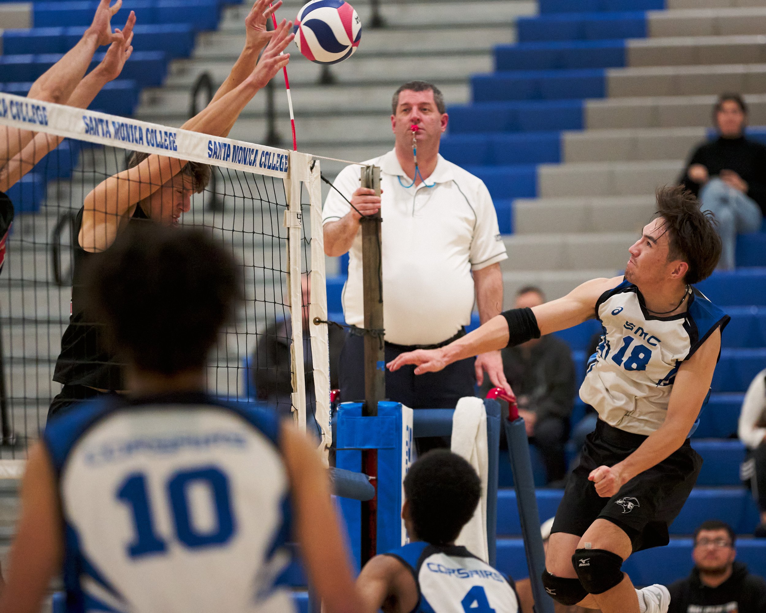  Long Beach City College Vikings' Cole Oliver blocks the ball sent from Santa Monica College Corsairs' Enkhtur Tserendavaa during the men's volleyball match on Friday, March 4, 2023, at Corsair Gym in Santa Monica, Calif. The Corsairs lost 3-0. (Nich