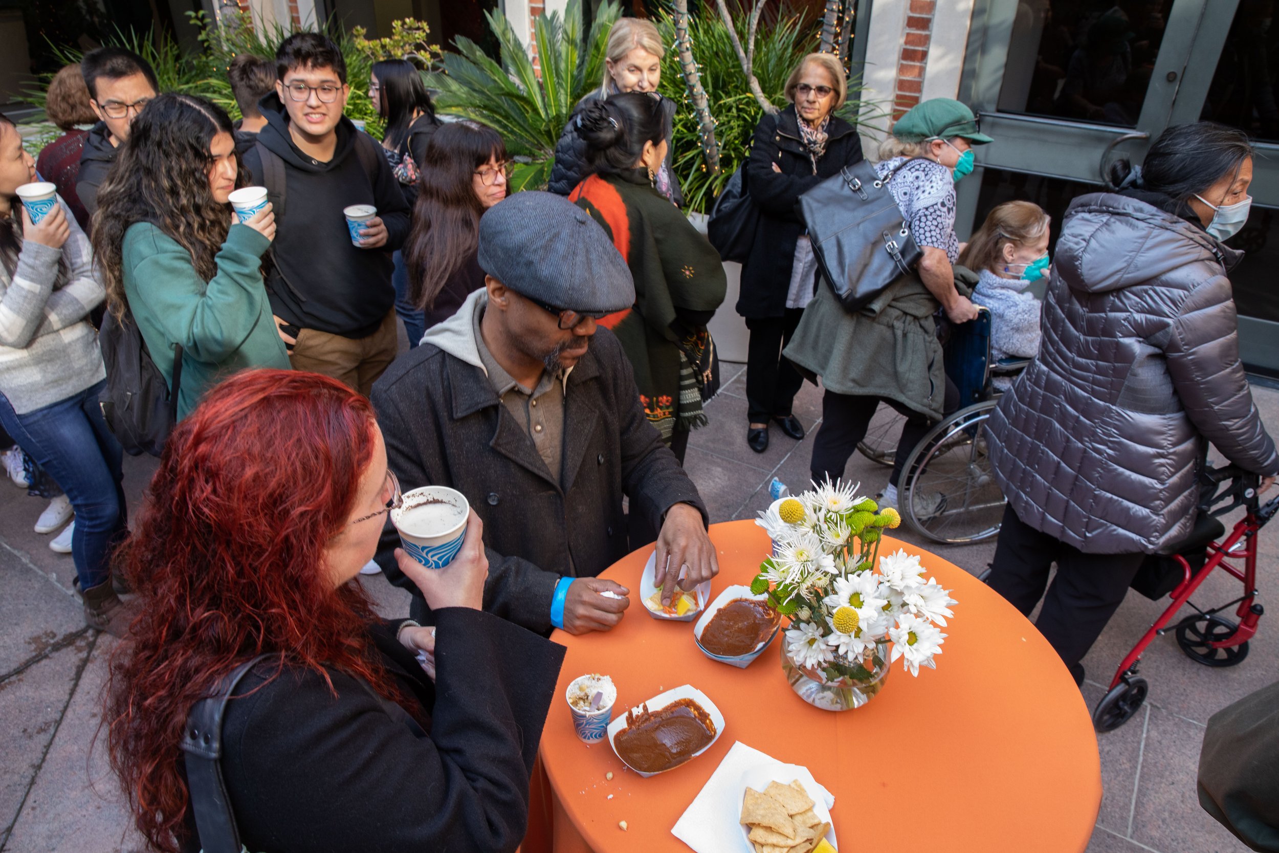  Attendees line up and enjoy themselves at a tasting reception after the screening of the documentary “Abuelita’s Kitchen: Mexican Food Stories” inside the Fowler Museum at UCLA main campus, Calif. March, Saturday 4, 2023  (Jorge Devotto | The Corsai