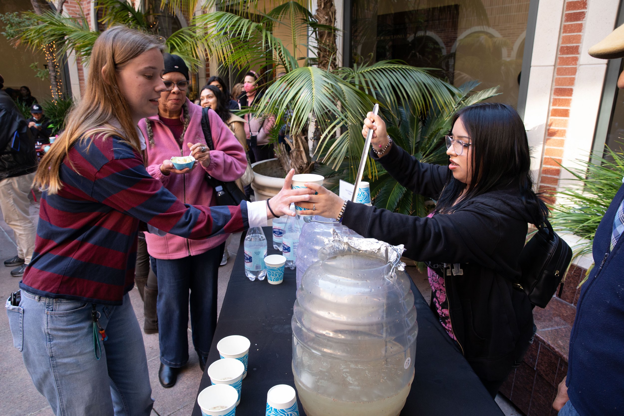  Deliana Baza grand daughter of abuelita Yolanda Baza featured in the movie fills cups with homemade horchata for the attendees. Reception after the screening of the documentary “Abuelita’s Kitchen: Mexican Food Stories” inside the Fowler Museum at U