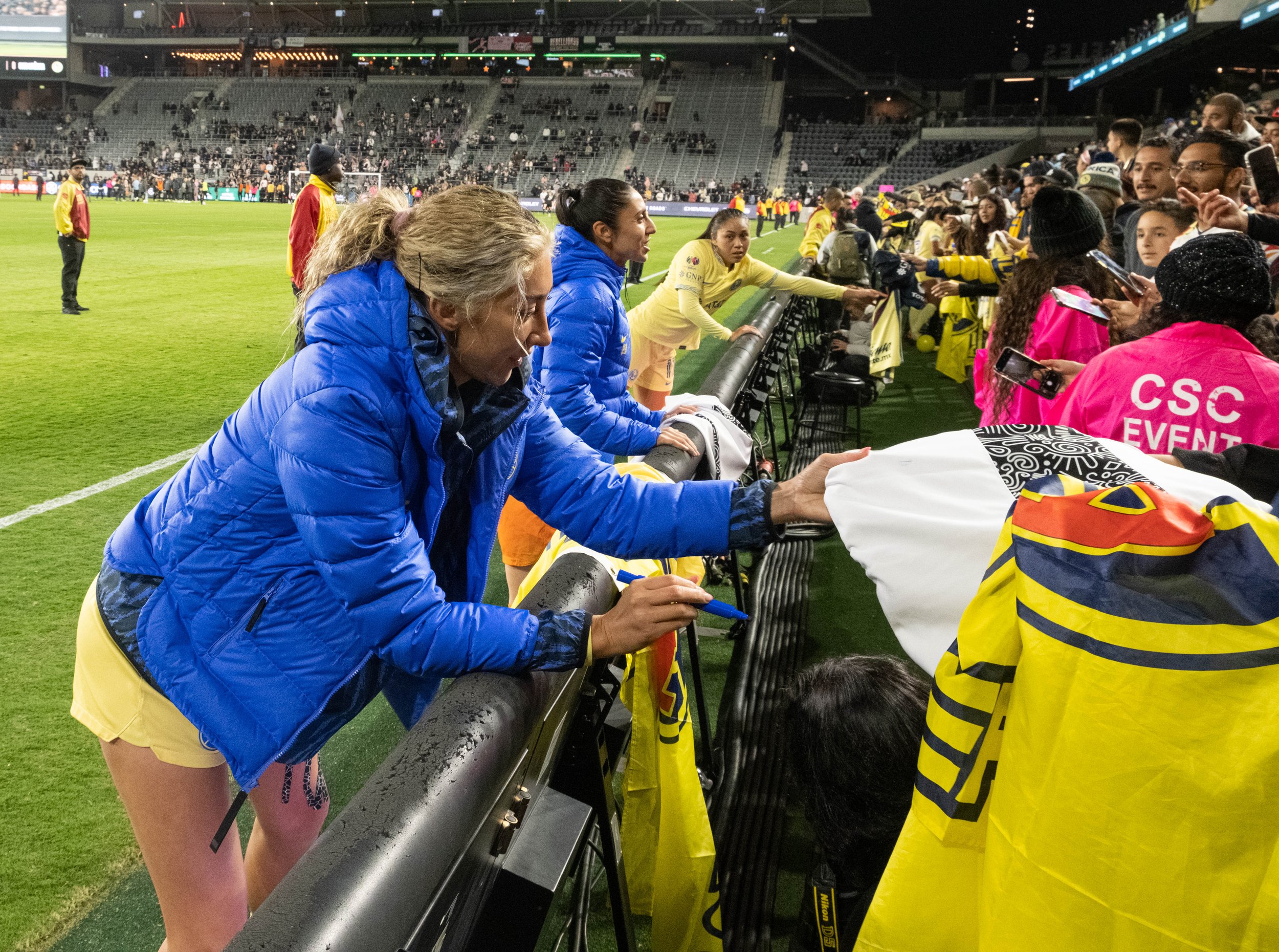  Club America Femenil fans passing items to Jocelyn Orejel(F) , Itzel Gonzales(M) and Montserrat Hernandez(B) for autographs at the end of the international friendly against Angel City Fc on Wed. March 8, 2023 at BMO Stadium in Los Angeles, Calif. (D