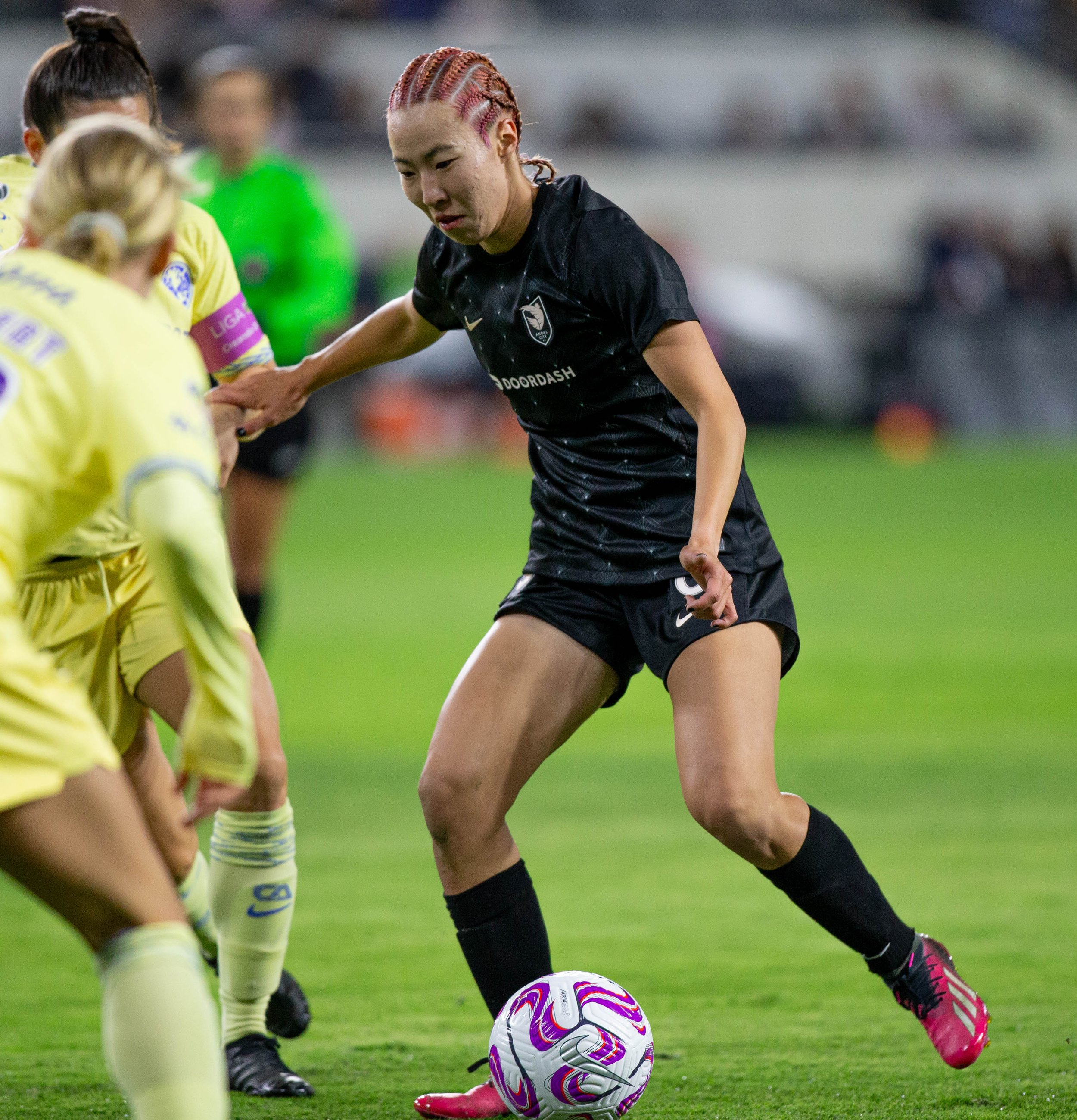  Jun Endo from Angel City FC attemepting to dribble past Club America Femenil captain, Andrea Pereira and midfielder, Sarah Luebbert during their international friendly on Wed. March 8, 2023 at BMO Stadium in Los Angeles, Calif. (Danilo Perez | The C