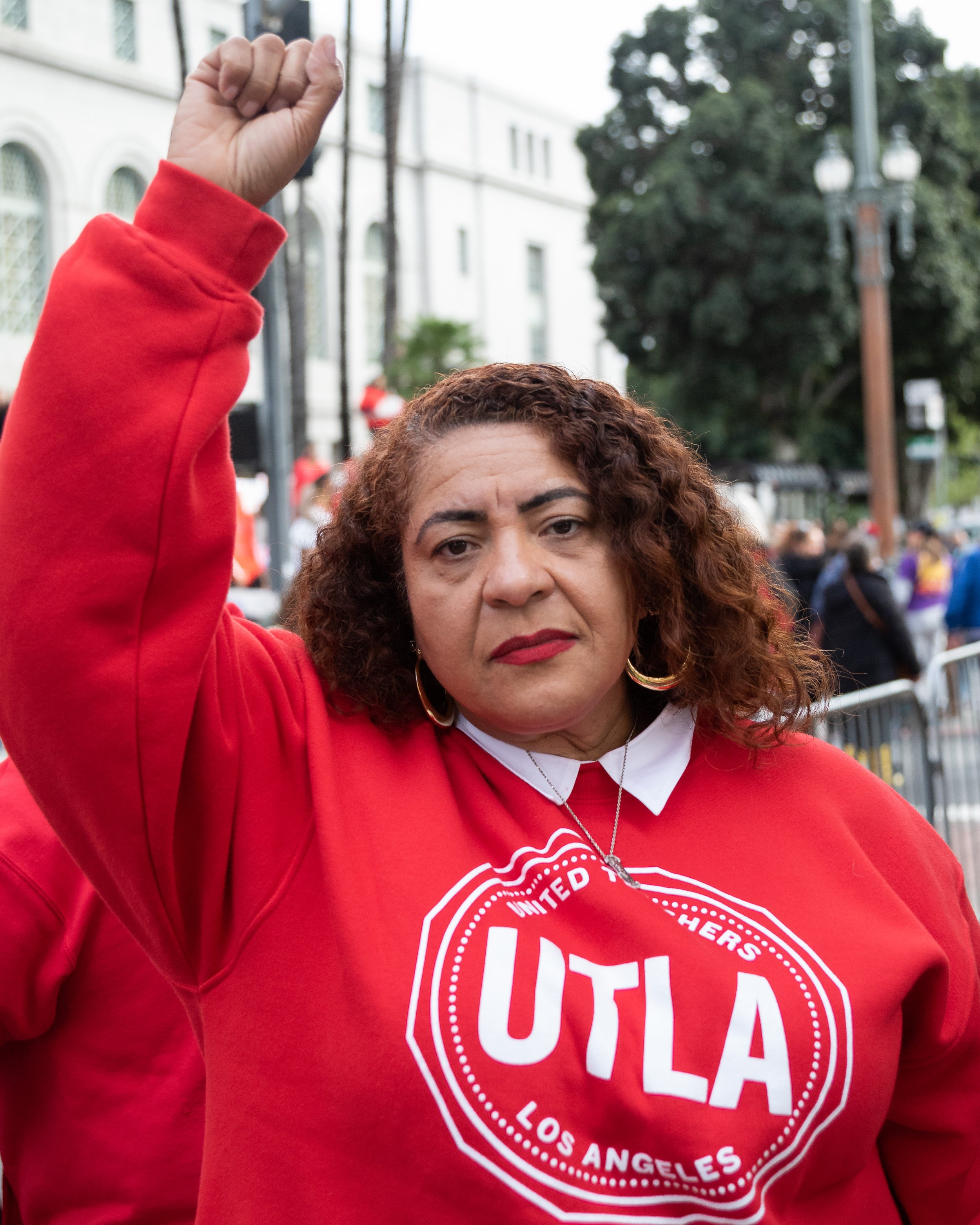  United Teachers Los Angeles (UTLA) president Cecily Myart-Cruz holding her fist in the air outside Los Angeles City Hall at a joint rally with Service Employees International Union (SEIU) Local 99 to announce the dates of a three-day strike in Los A