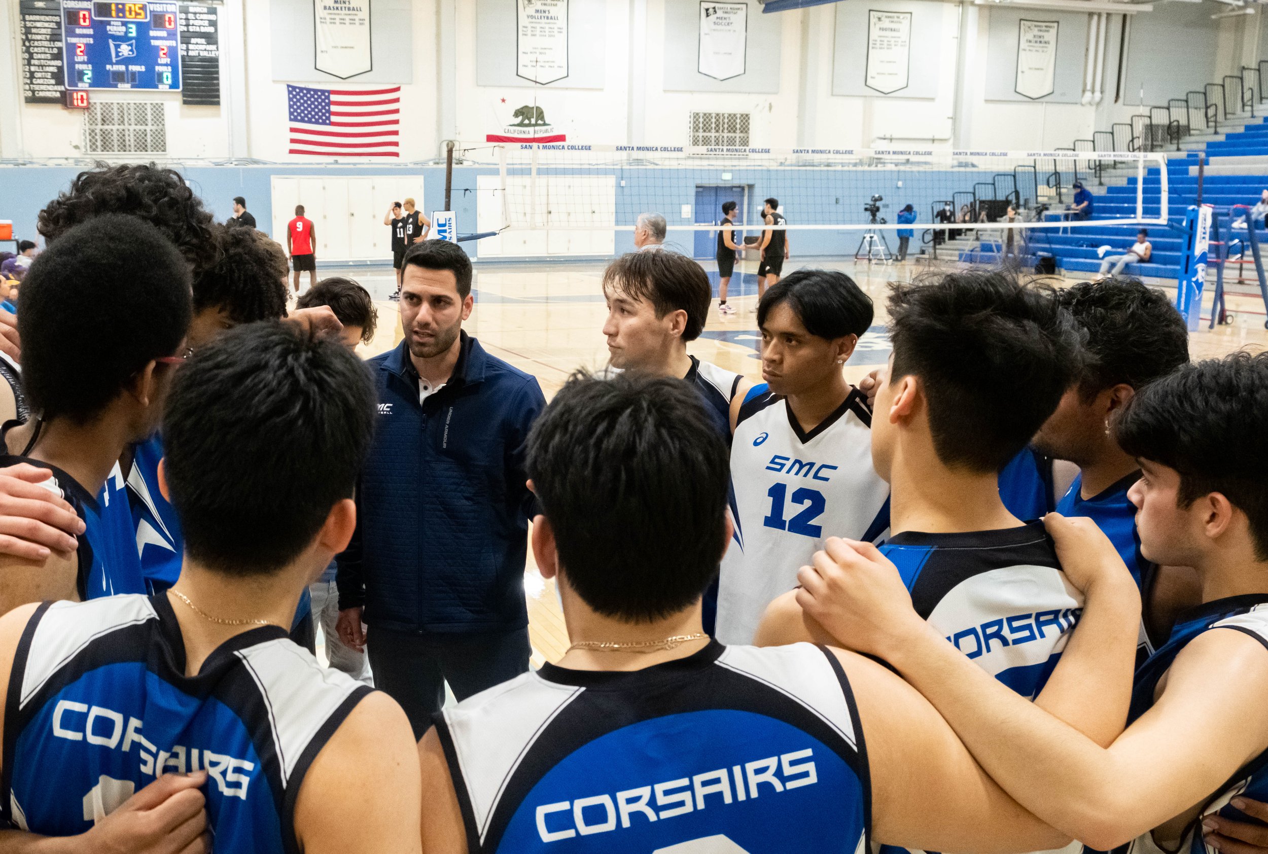  Santa Monica College(SMC) Corsairs men's volleyball team huddled up with head coach Liran Zamir before the start of the third period against the Brahma Bulls from L.A. Pierce College on Wed. March 15, 2023 at the SMC Pavillion Gym in Santa Monica, C