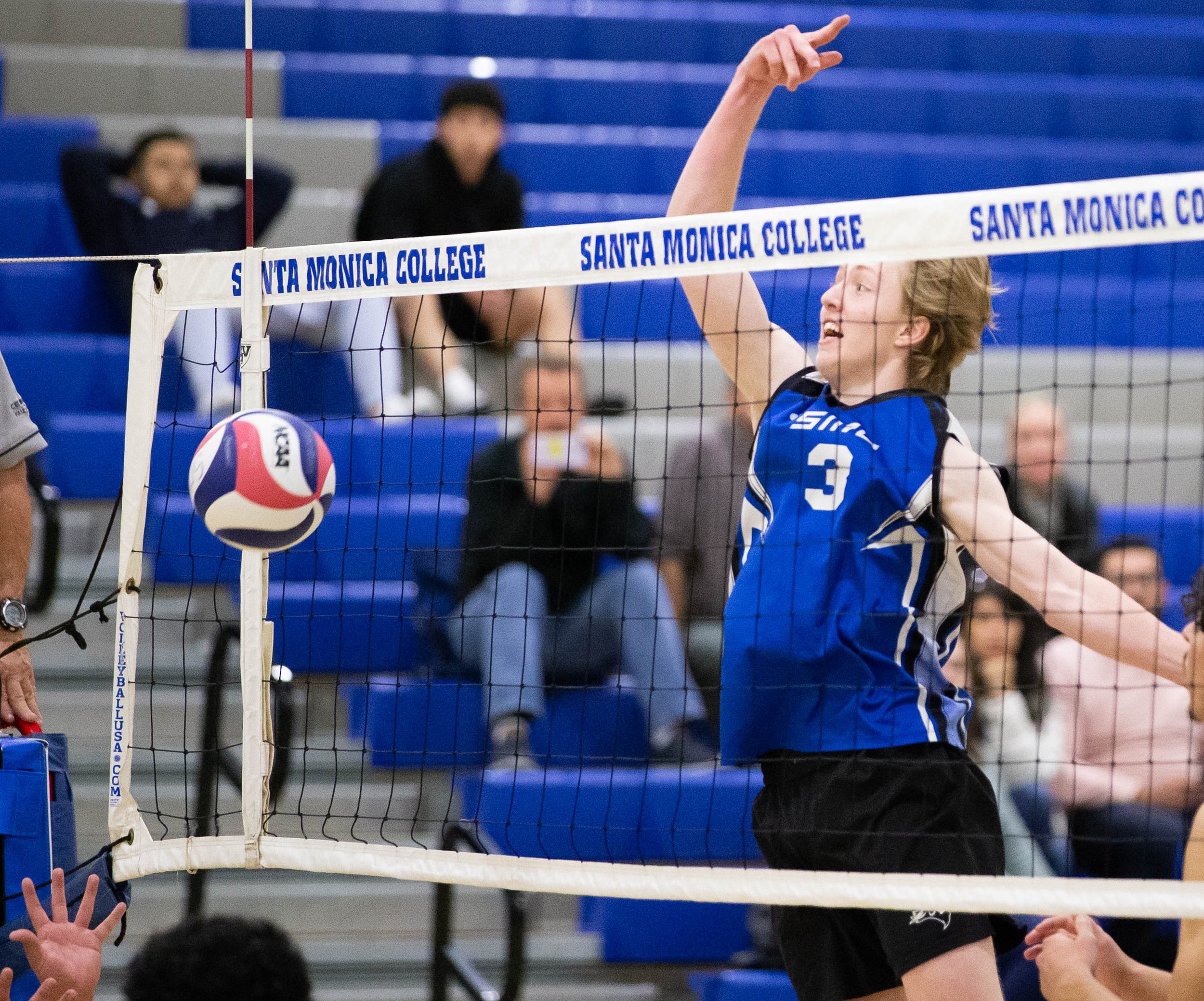  Camden Higbee(3), setter, for the Santa Monica College(SMC) Corsairs faking a strike set up but confusing L.A. Pierce College Braham Bulls by tapping it to their side of the court for the point on Wed. March 15, 2023 in the SMC Pavillion at Santa Mo