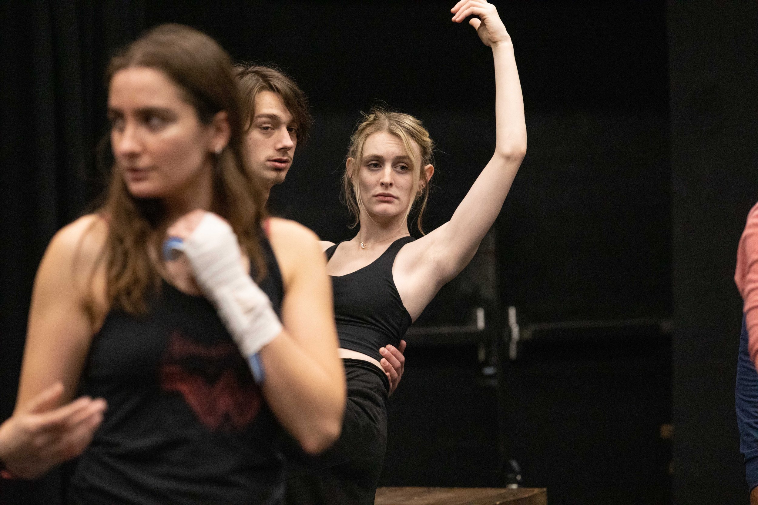  In the back, SMC students Allie Jensen (right) with her dancing partner classmate Myckinnon Forsyth glancing back for instructions from teachers offscreen at a class rehearsal for the musical “Hunchback of Notredame”. Theater Arts building at SMC ma