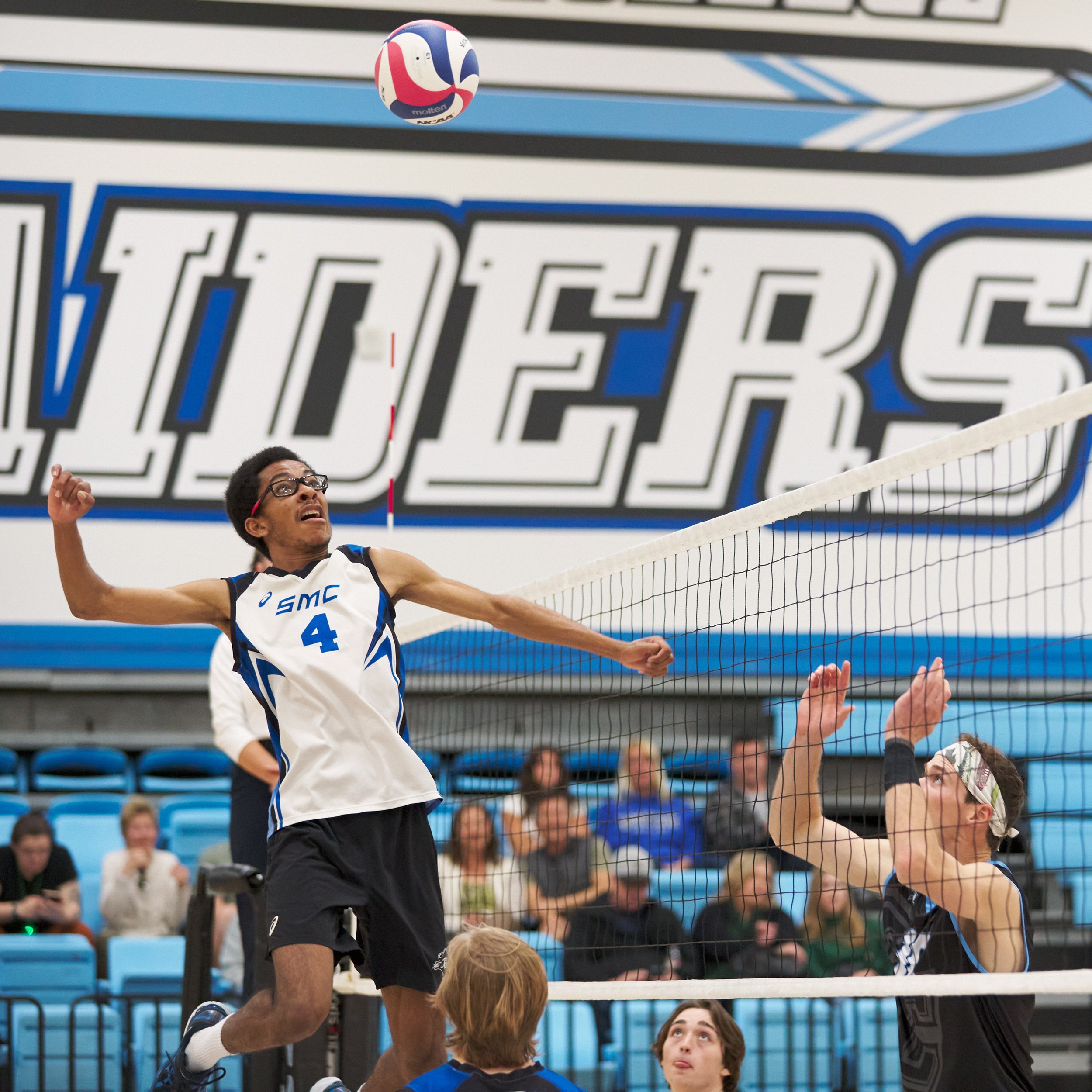  Santa Monica College Corsairs' Beikwaw Yankey winds up to hit the ball past Moorpark College Raiders' Sean Schmutz during the men's volleyball match on Friday, March 17, 2023, at Moorpark College's Gymnasium in Moorpark, Calif. The Corsairs lost 3-1
