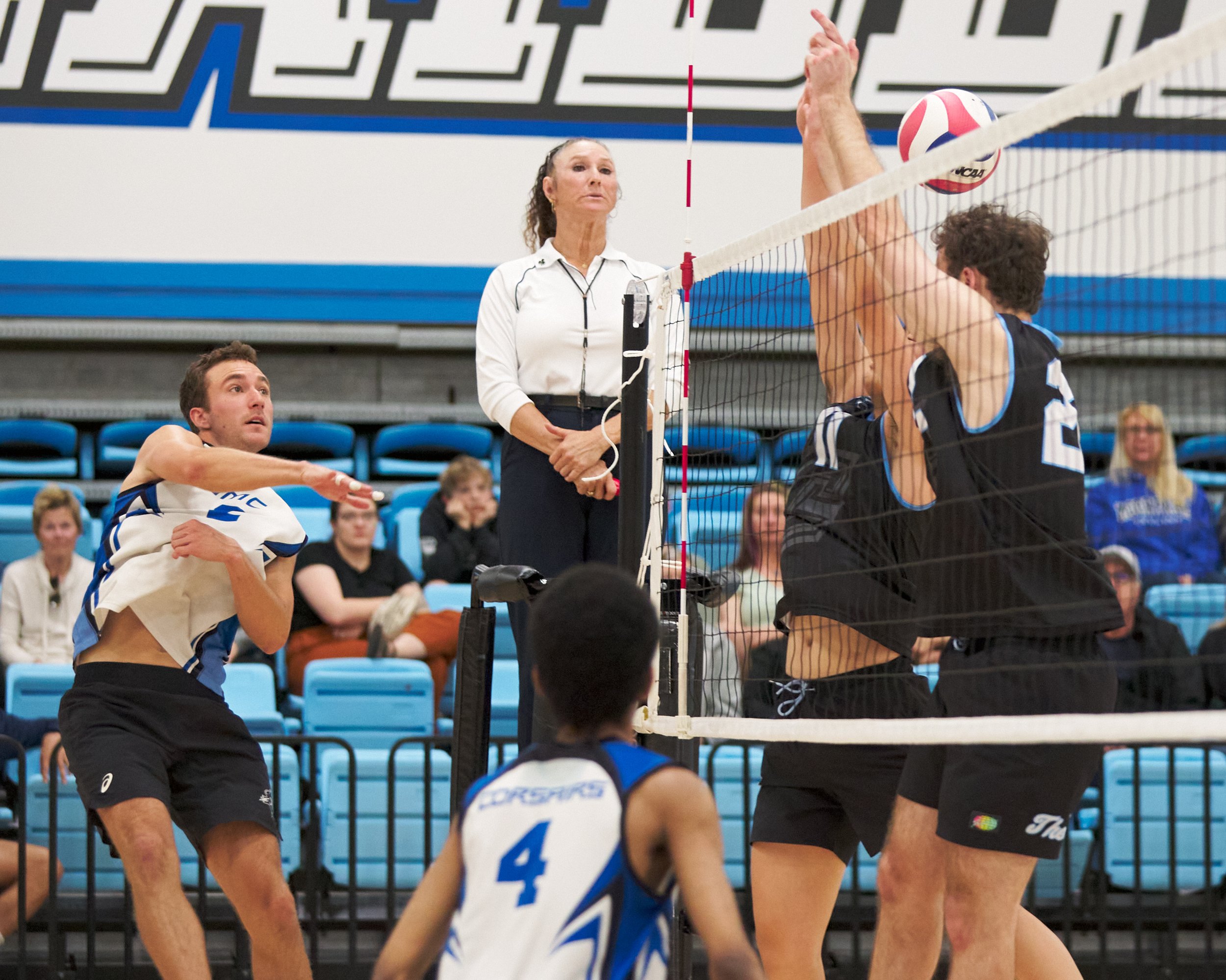  Santa Monica College Corsairs' Kane Schwengel sends the ball past Moorpark College Raiders' Eddy He and Jaxon Rust during the men's volleyball match on Friday, March 17, 2023, at Moorpark College's Gymnasium in Moorpark, Calif. The Corsairs lost 3-1