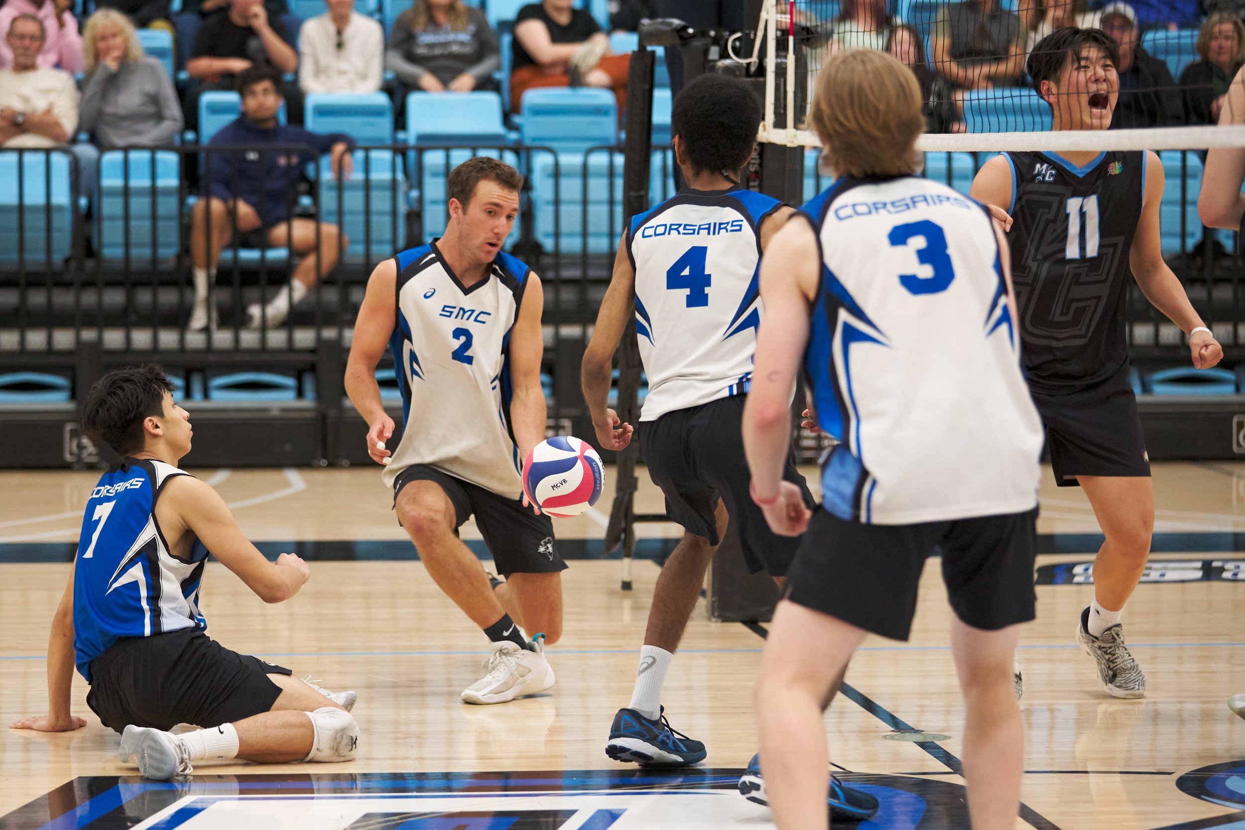  Santa Monica College Corsairs' Javier Castillo, Kane Schwengel, Beikwaw Yankey, and Camden Higbee drop the ball, while Moorpark College Raiders' Eddy He cheers during the men's volleyball match on Friday, March 17, 2023, at Moorpark College's Gymnas