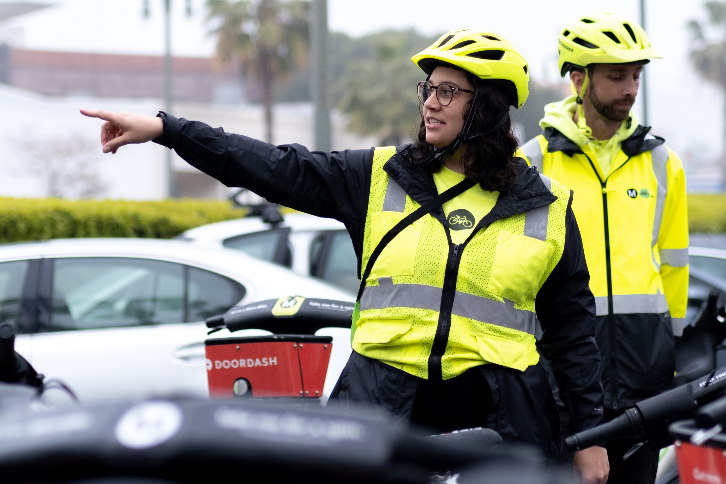  Kimberly Fisher, Senior Marketing Coordinator for Outreach, explains the route we will be taking on the Metro Bike Share Women's History Community Ride this rainy morning in Downtown Los Angeles, Calif. on Saturday, March 11, 2023. (Akemi Rico | The