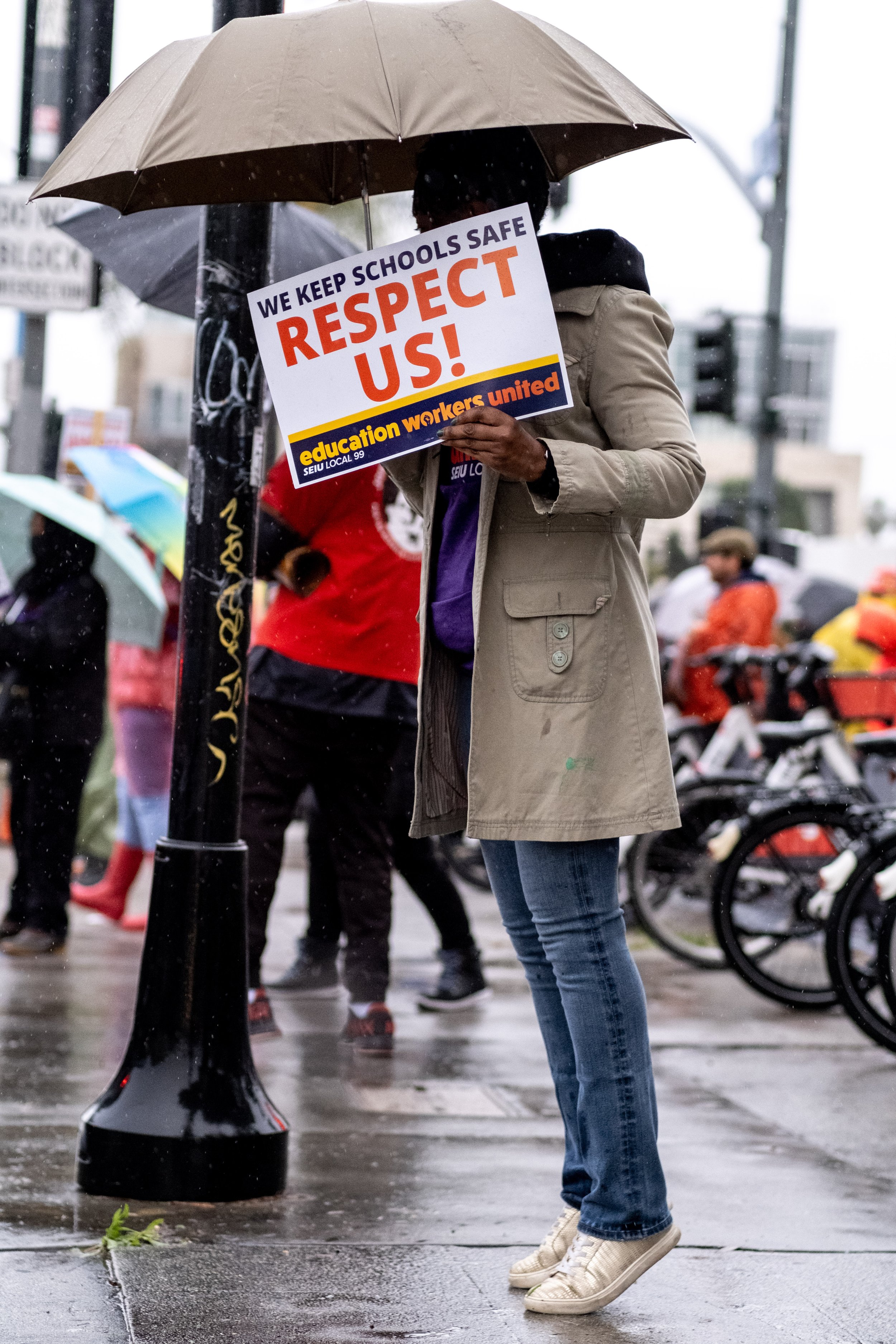  Anonymous protester holds a sign supporting Los Angeles Unified School District staff while on strike in front of Hollywood High School, in Los Angeles, Calif. on Tuesday, March 21, 2023. (Akemi Rico | The Corsair) 