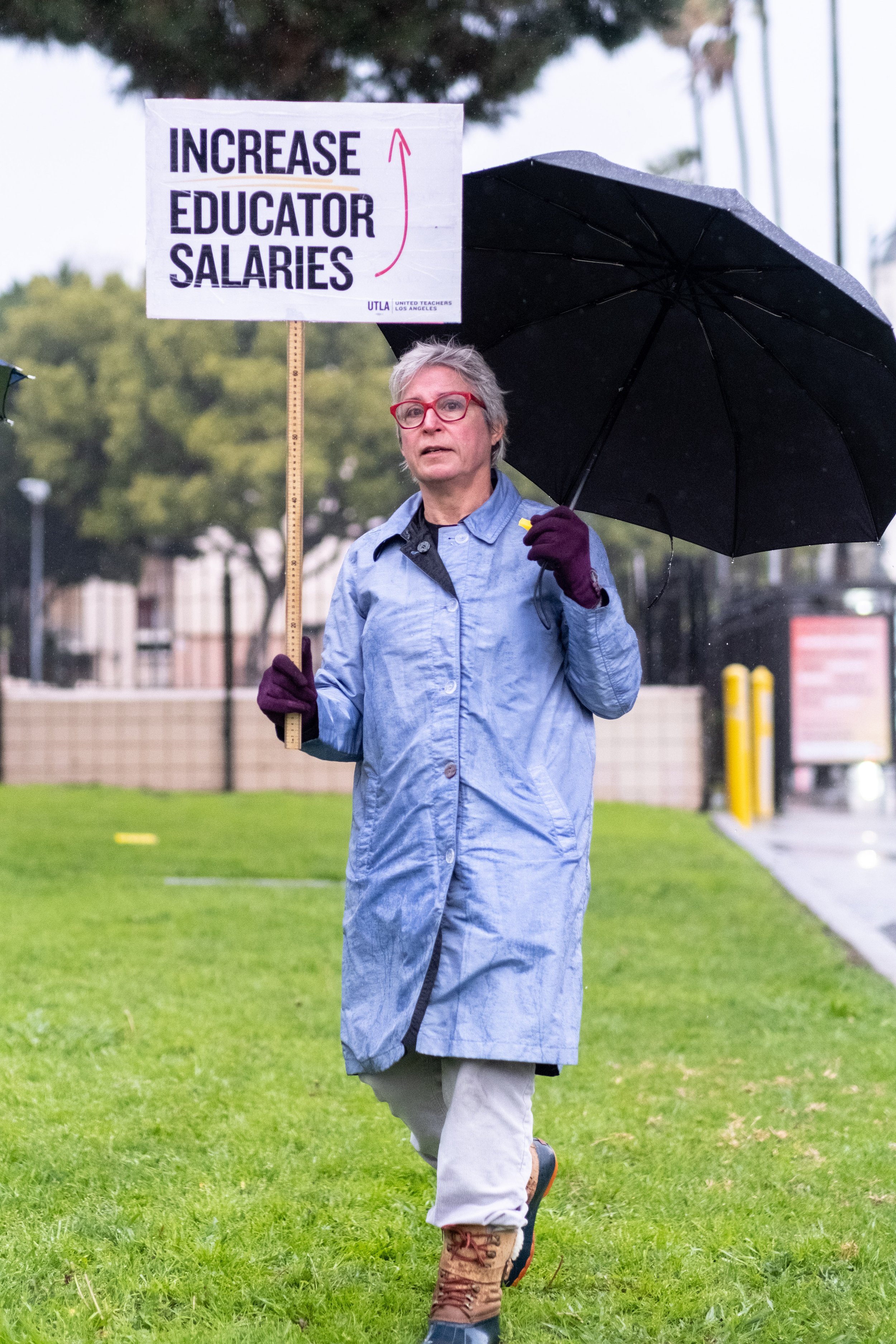  Karen Cusolito, English and Journalism teacher at Hollywood High School, holds a sign in support of the Service Employees International Union (SEIU) strike in Los Angeles, Calif. on Tuesday, March 21, 2023. (Akemi Rico | The Corsair) 