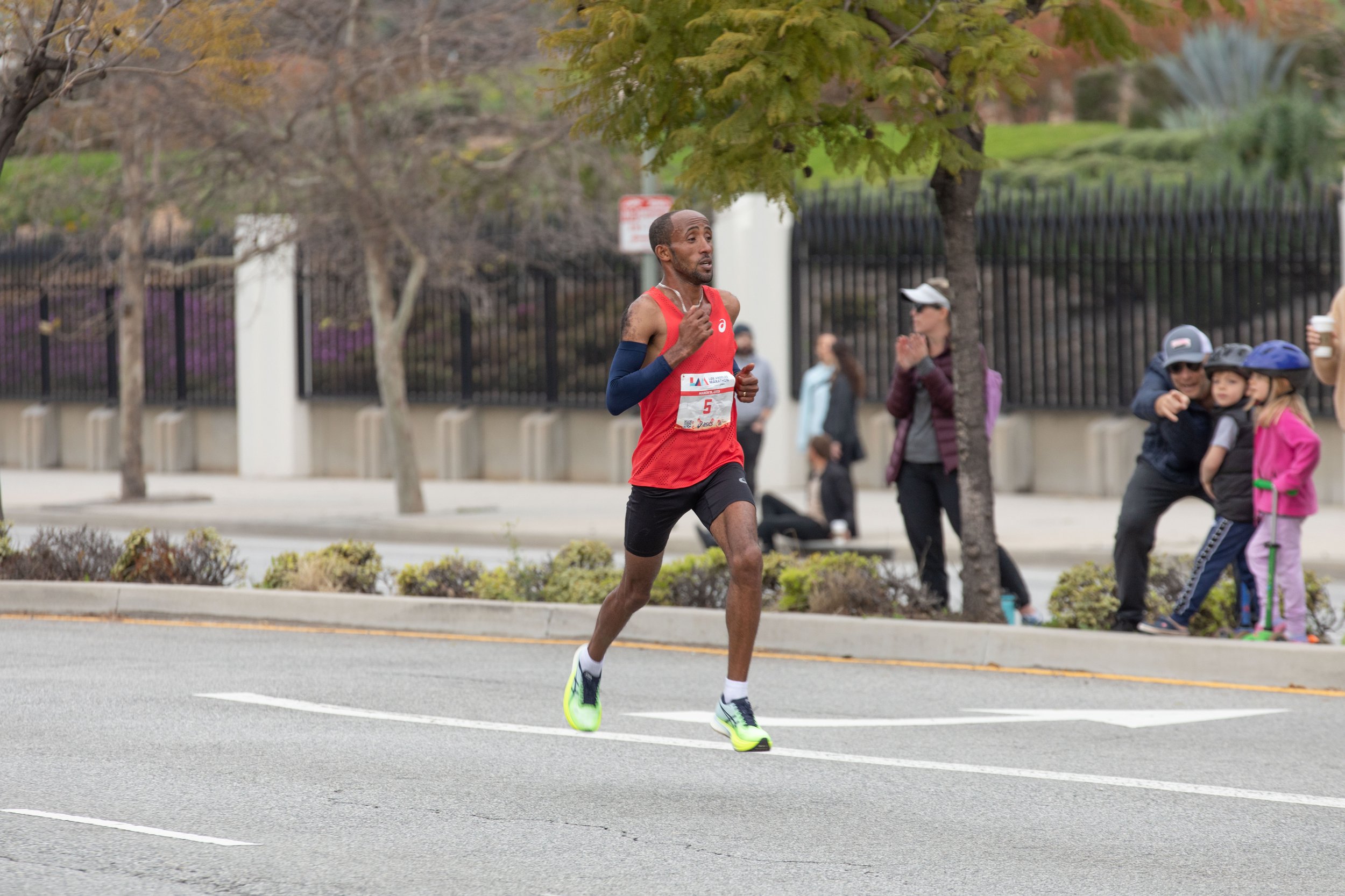  Jemal Yimer on a red shirt from Ethiopia running on Santa Monica Blvd. heading East to the finish line during the L.A. Marathon 2023. Yimer won the male competition with a time of 2 hours, 13 minutes, 14 seconds. Sunday, March 19, 2023. Los Angeles,