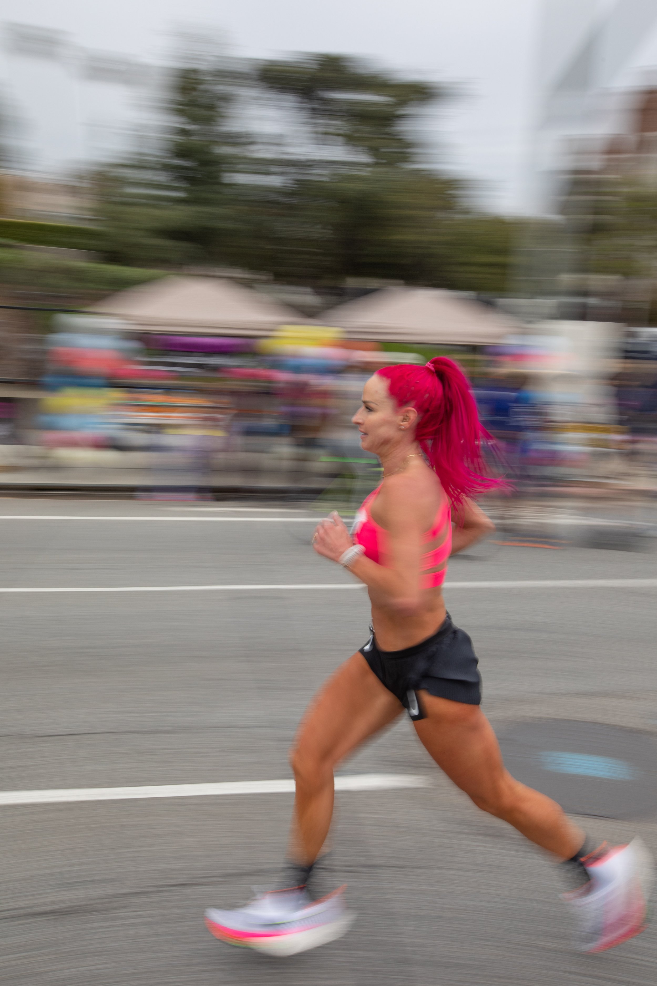  American Ashley Poulson from Mendon, Utah running on Santa Monica Blvd. heading West just passing through cheers on mile 19 during the L.A. Marathon 2023. Poulson placed in fourth behind the three female Kenyans that got into top positions. Sunday, 