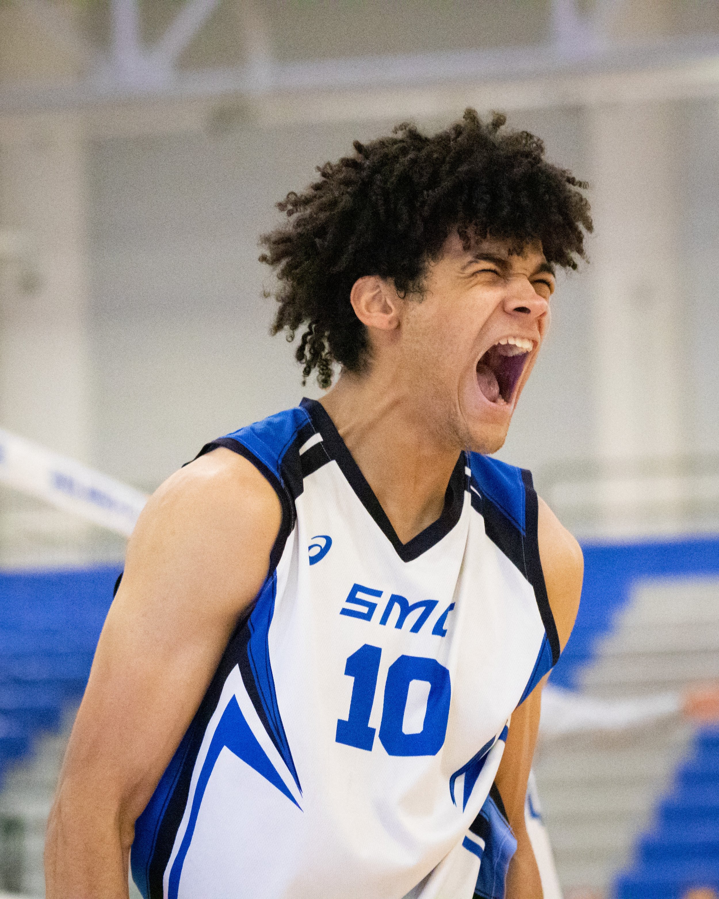  Santa Monica College Corsair outside hitter Nate Davis cheering after the Corsairs score during the first set of a home game against Santa Barbara City College Vaqueros in Santa Monica, Calif., on Friday, March 24, 2023. The game resulted in the Cor