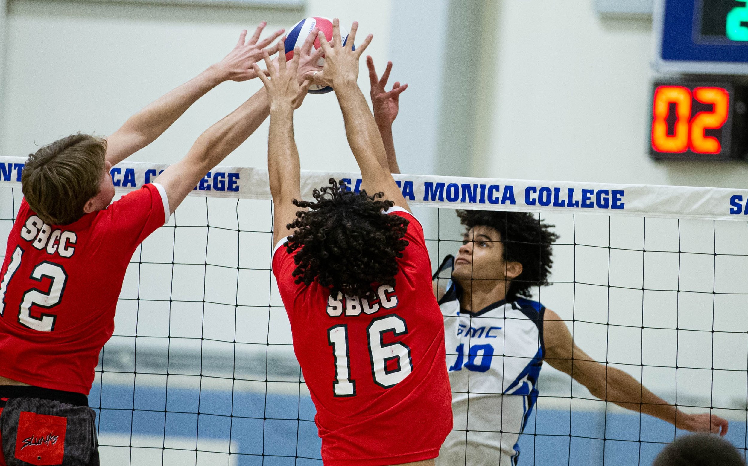  Santa Monica College Corsairs Nate Davis(10) attempting to spike the ball against the Santa Barbara City College Vaqueros during their match but being blocked by two players on Fri. March 24 in the Corsair Gym at Santa Monica, Calif. (Danilo Perez |