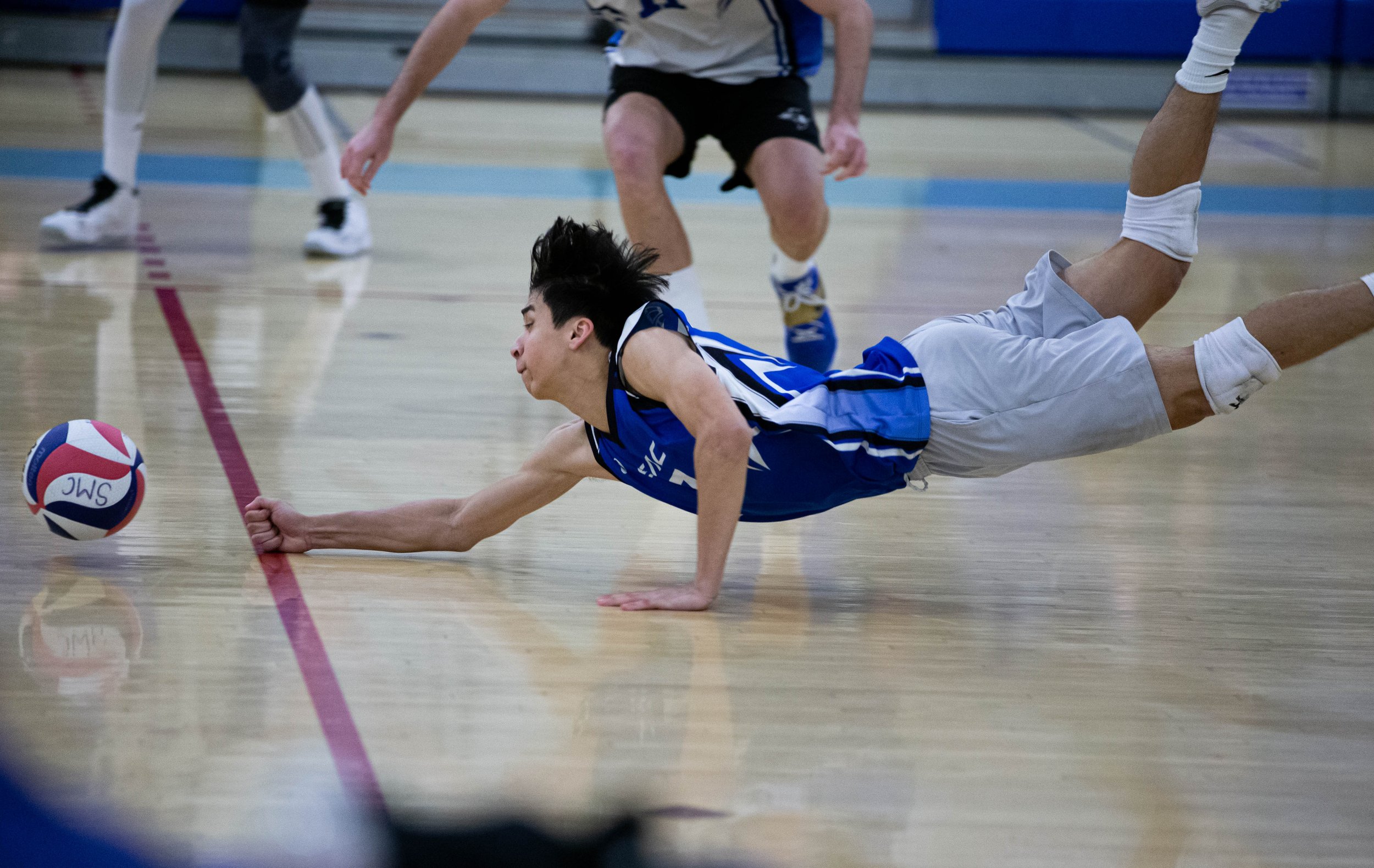  Santa Monica College Corsairs libero Javier Castillo(7) unable to recover the ball from hitting the floor after it was hit by one of the players from the Santa Barbara City College Vaqueros on Fri. March 24 in the Corsair Gym at Santa Monica, Calif.