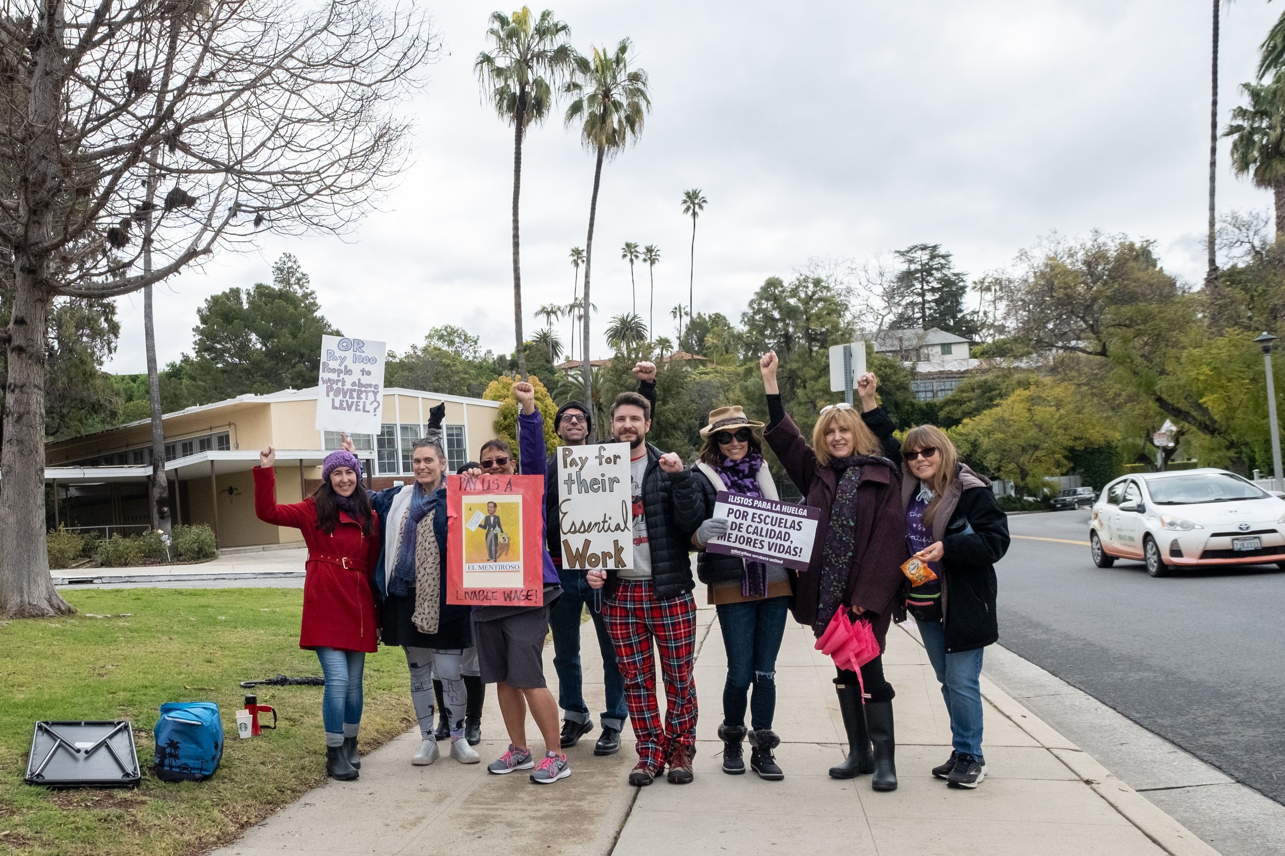  Teachers and staff in front of Paul Revere Charter Middle School in Los Angeles, Calif. Thursday, March 23, 2023, on the third day of the strike supporting the Service Employees International Union, Local 99 (SEIU). Steven_, holding a sign saying "P