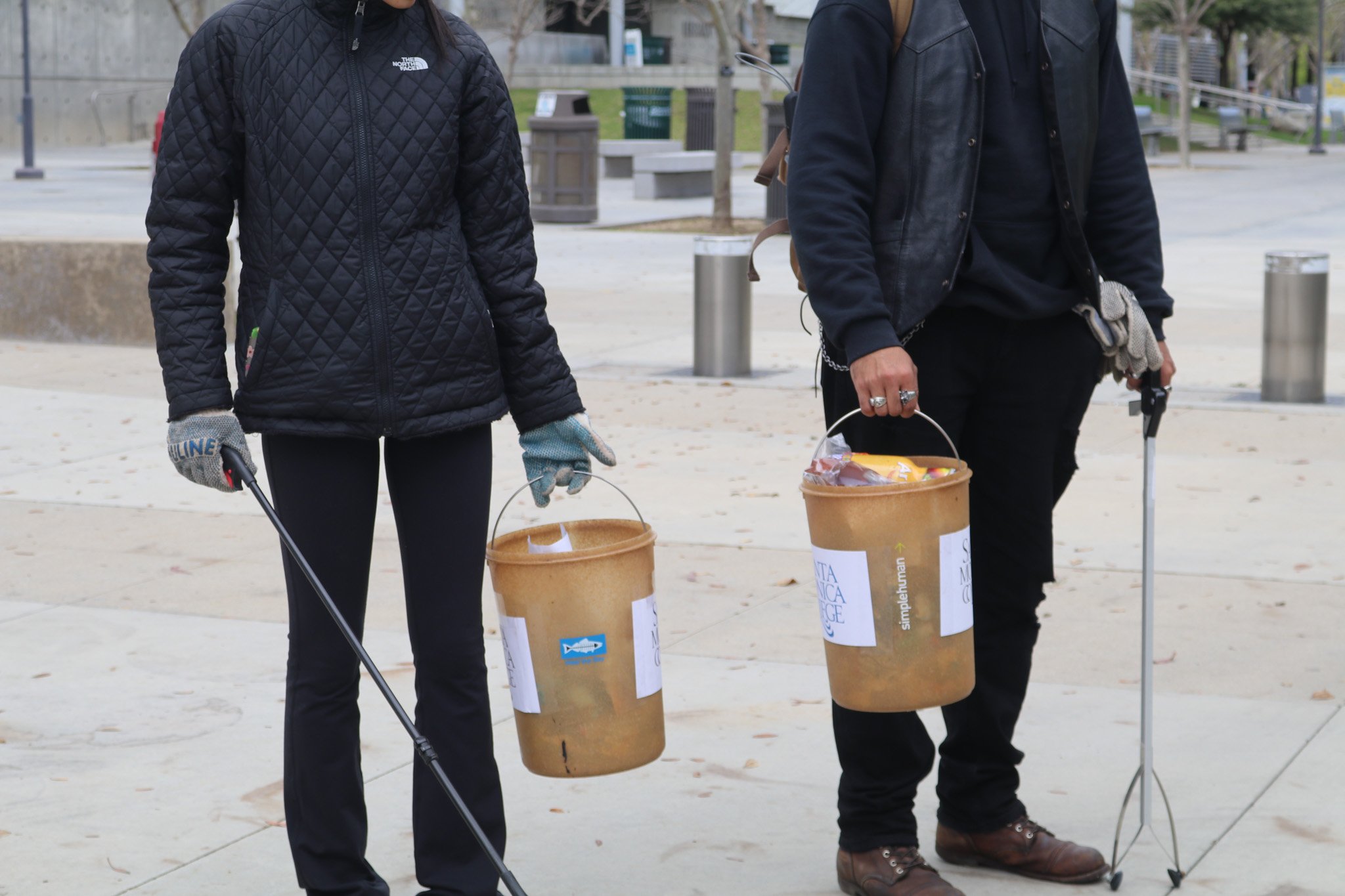  Students hold full buckets of trash collected around the Santa Monica College campus in Los Angeles, Calif. on March 23, 2023.  (Photo: Presley Alexander/The Corsair) 