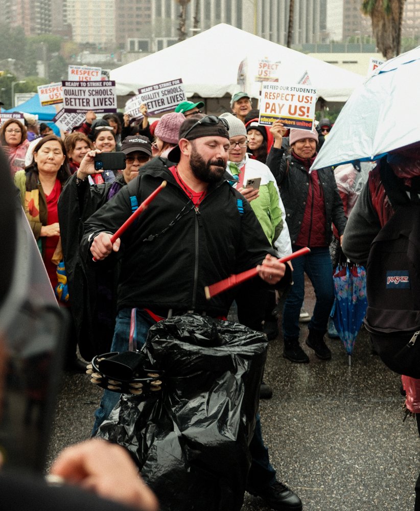  Attendee at the United Teachers Los Angeles(UTLA) rally outside the Los Angeles Unified School District playing the drums covered with a trash bag on Tue. March 21 at Los Angeles, Calif. (Danilo Perez | The Corsair) 