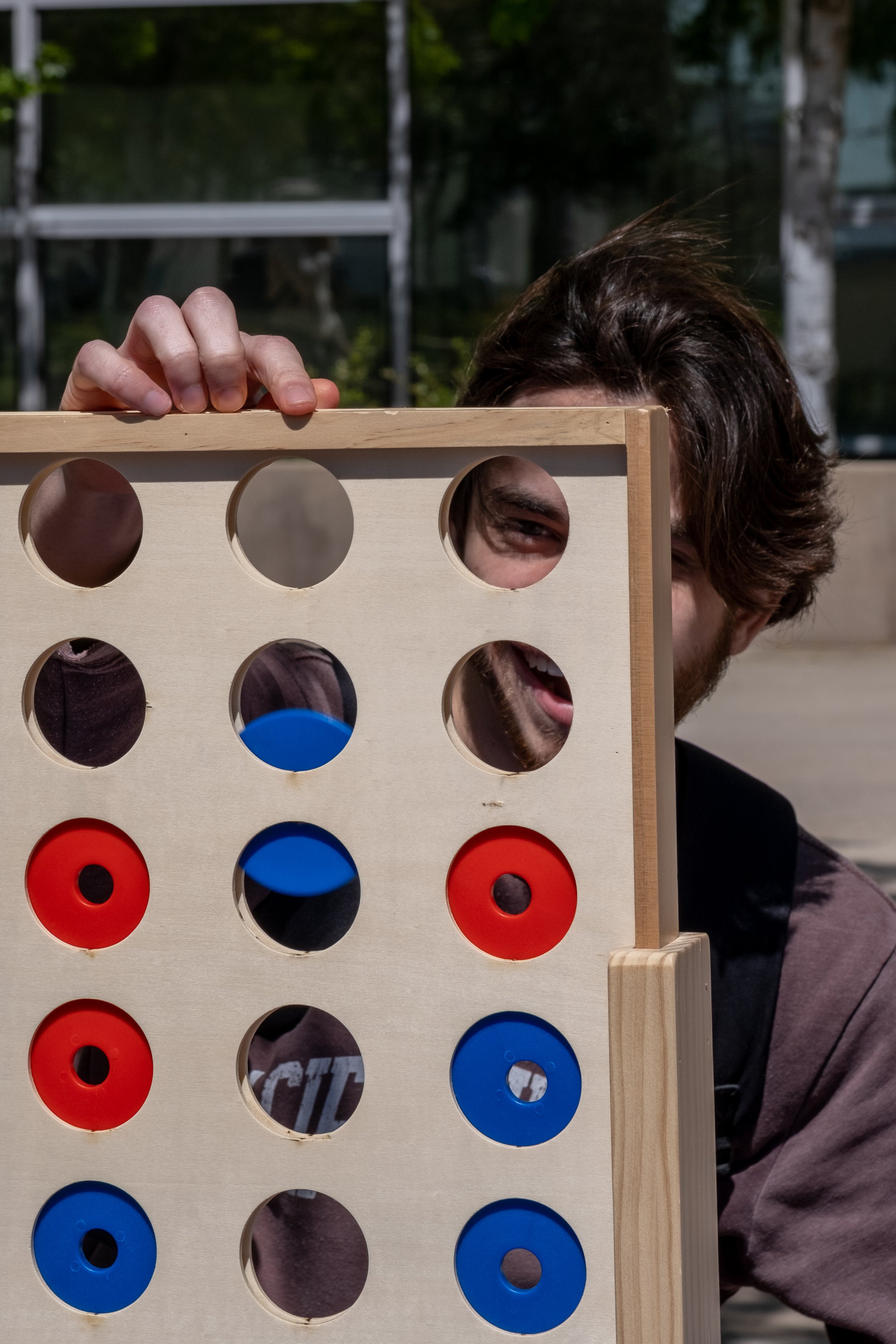  Sebastian Billot, nursing major, plays Connect Four on the Quad at Motivational Madness, an event for students to relax and take a break from studying on Tuesday, March 4th, 2023 at Santa Monica College, Santa Monica, Calif. (Akemi Rico | The Corsai