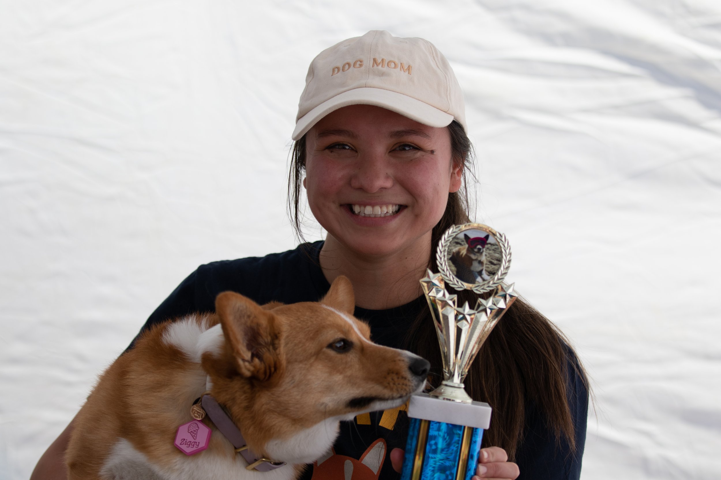  Jassica Ramberg holding up her dog, Ziggy, and their trophy after they won the Corgi Limbo Contest during Corgi Beach Day at Huntington Dog Beach, Huntington Beach, Calif., on Saturday, April 1, 2023. There were over a thousand people in attendance 
