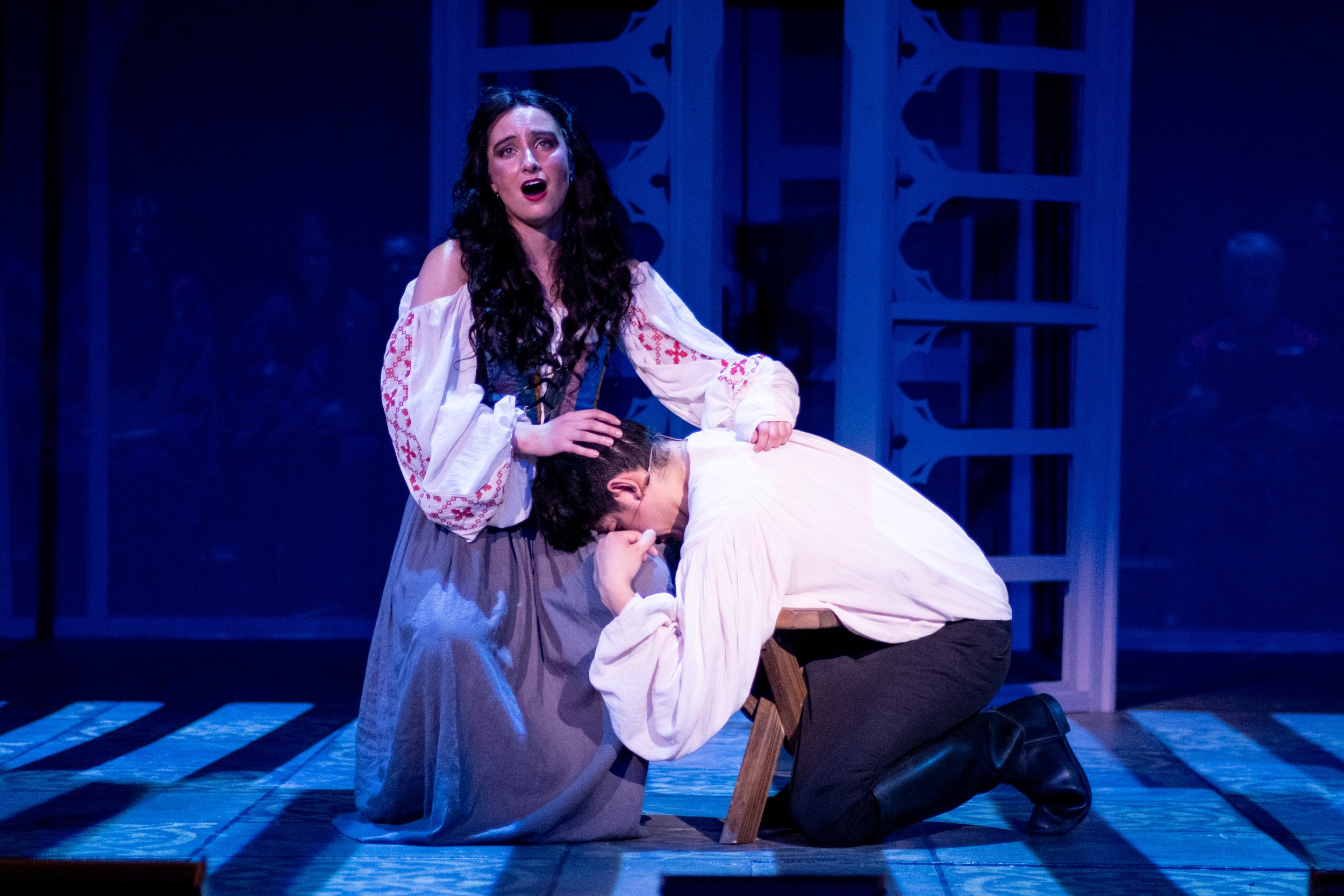  Esmeralda, played by Tayla Sindel, sings woefully while Captain Phoebus de Martin, played by Joseph Martinez, buries his head in her lap in light of the tragedy they have found themselves in during the musical production, The Hunchback of Notre Dame