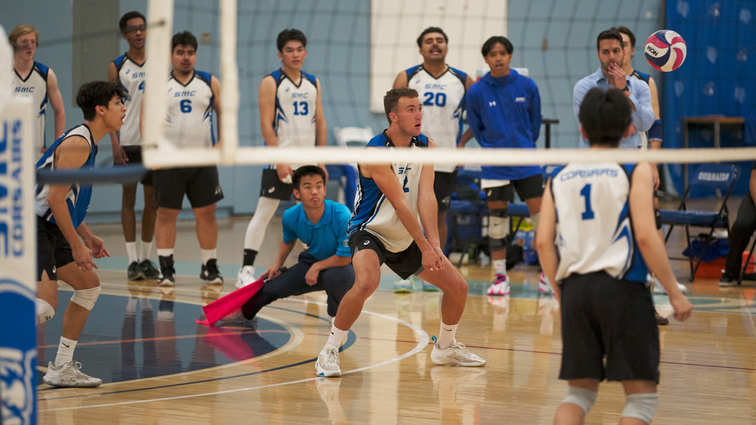  Santa Monica College Corsairs' Kane Schwengel (center) receives a serve during the men's volleyball match against the Moorpark College Raiders on Wednesday, April 12, 2023, at Corsair Gym in Santa Monica, Calif. The Corsairs lost 3-0. (Nicholas McCa