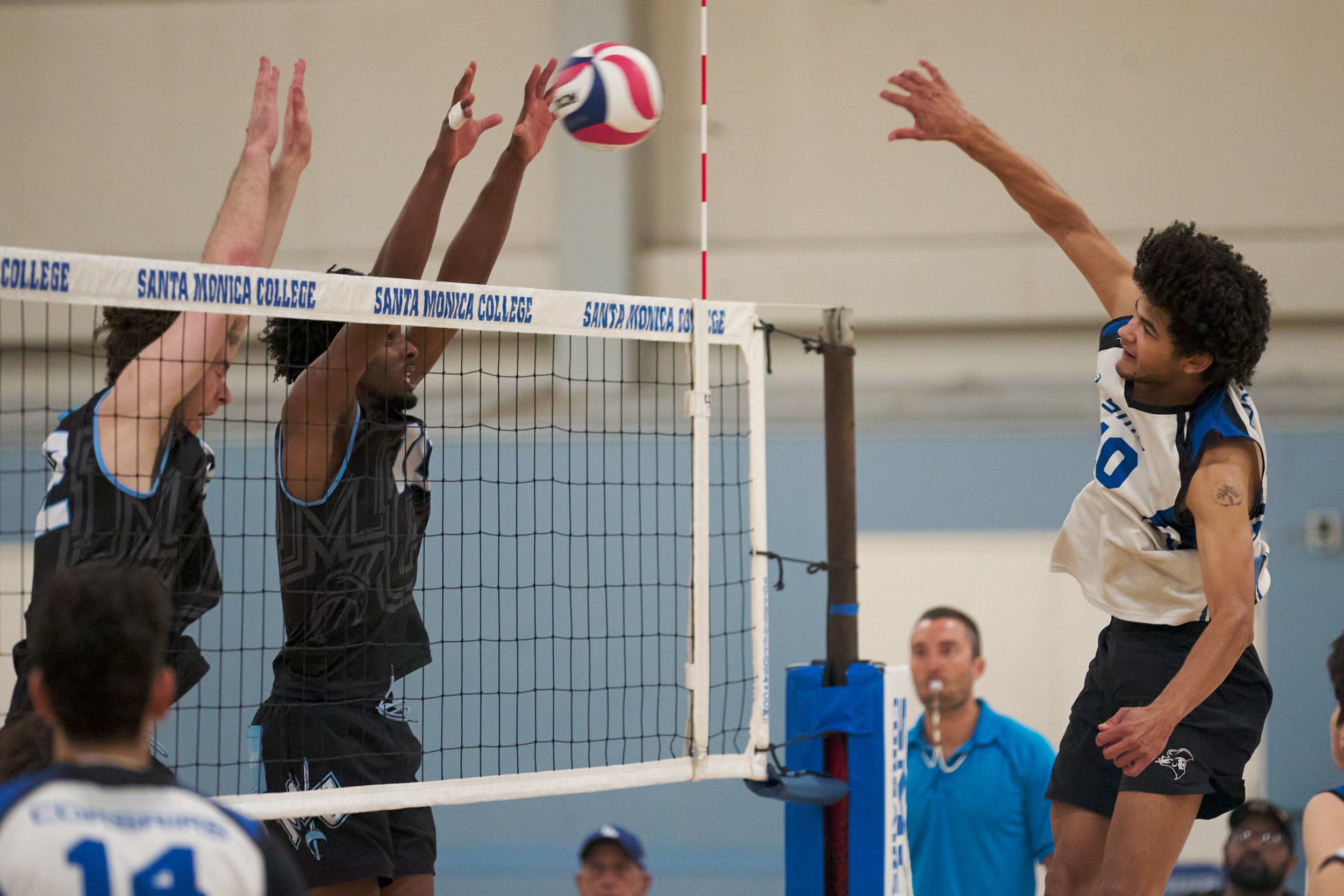 Moorpark College Raiders' Jaxon Rust and Ebba Tefera block an attack from Santa Monica College Corsairs' Nate Davis during the men's volleyball match on Wednesday, April 12, 2023, at Corsair Gym in Santa Monica, Calif. The Corsairs lost 3-0. (Nichol