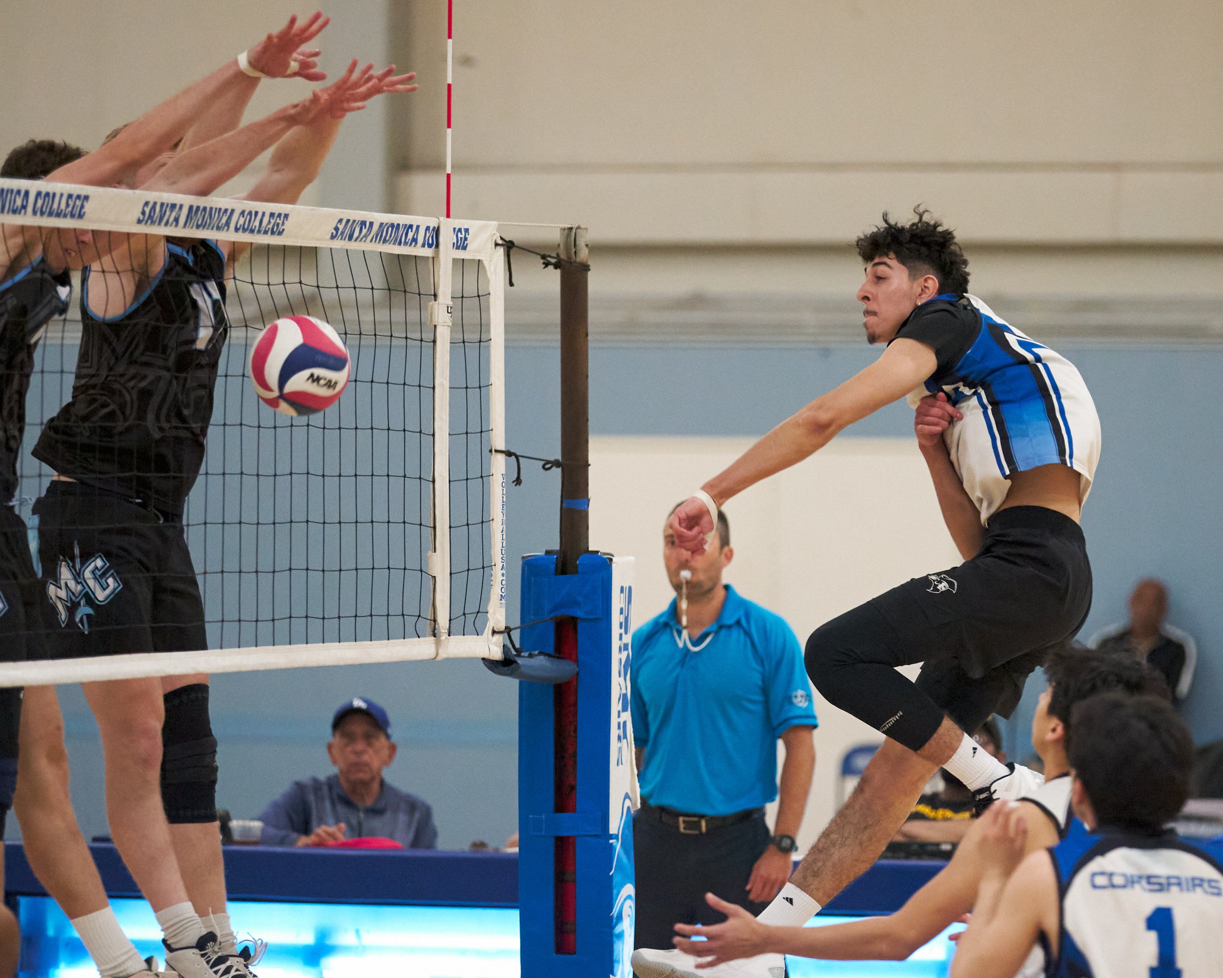  Moorpark College Raiders' Sean Schmutz and Michael Stahl block an attack from Santa Monica College Corsairs' Luis Garzon during the men's volleyball match on Wednesday, April 12, 2023, at Corsair Gym in Santa Monica, Calif. The Corsairs lost 3-0. (N