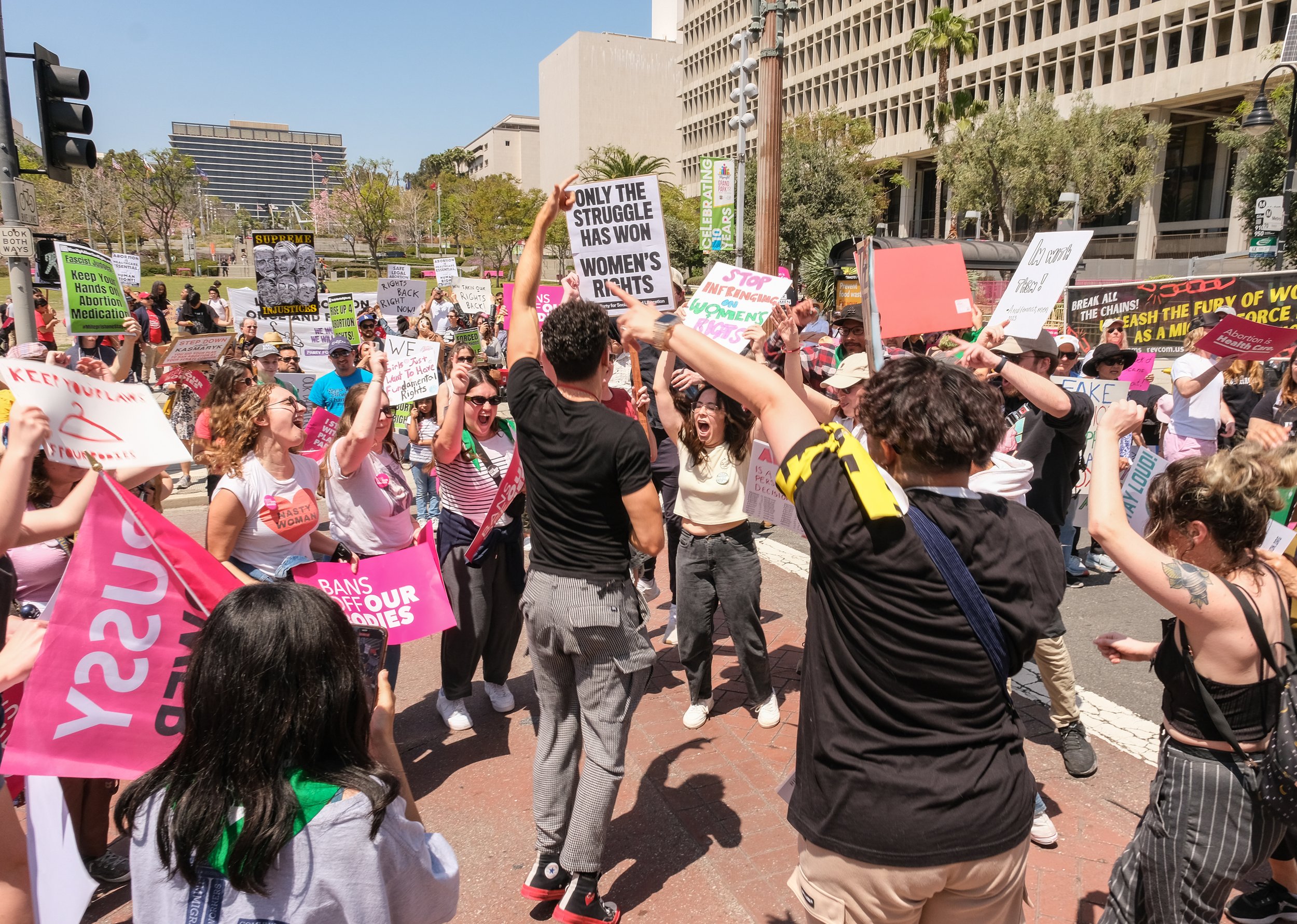  Demonstrators from Woman's March Foundation and other organizations are dancing together in front city of City Hall Los Angeles April 15,2023 (Alejandro Contreras | The Corsair) 