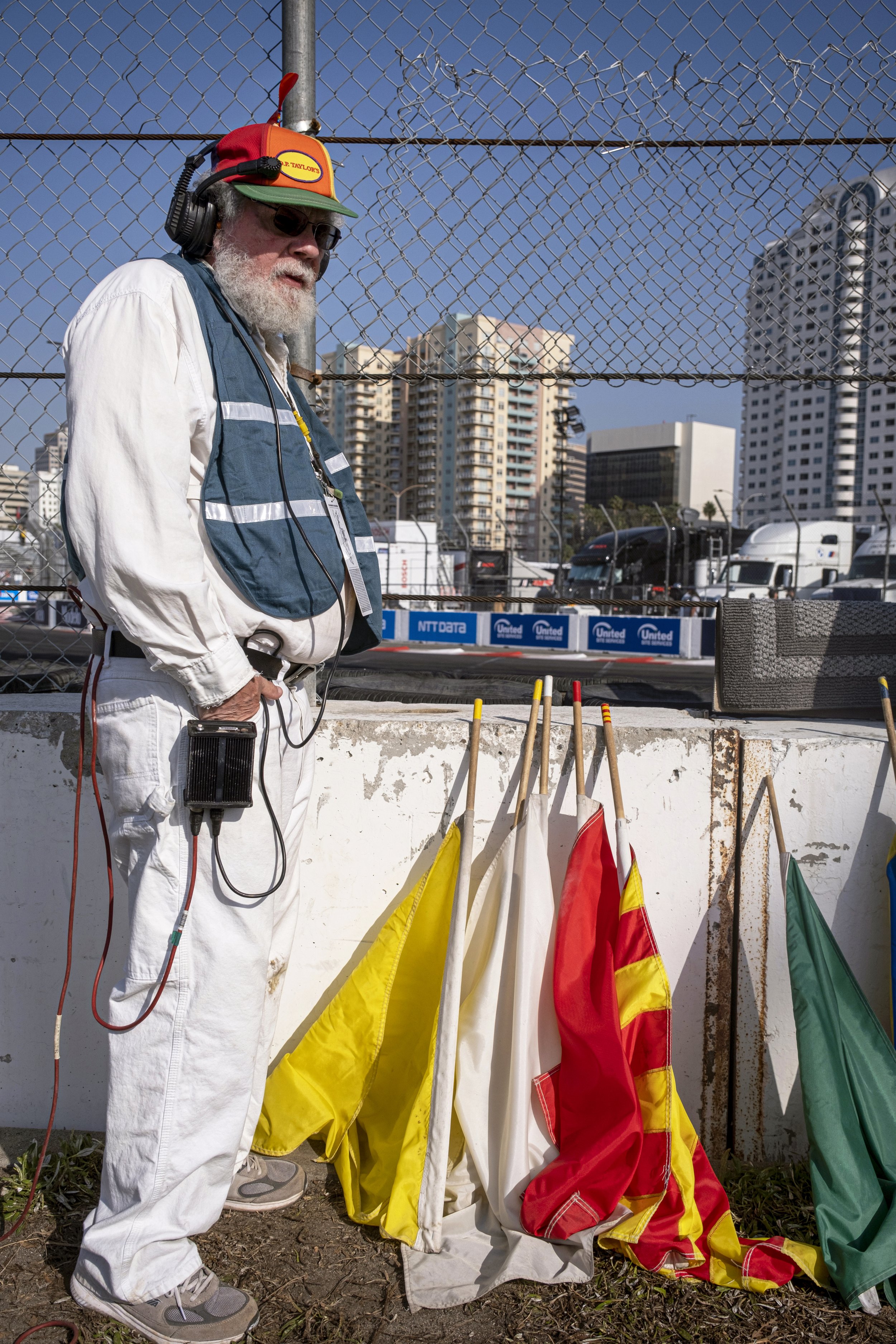  Racing marshal stands by flags, which colors corrospond and signal different conditions. 48th Annual Acura Grand Prix in Long Beach, Calif. on Sat., April 15, 2023. (Anna Sophia Moltke | The Corsair) 