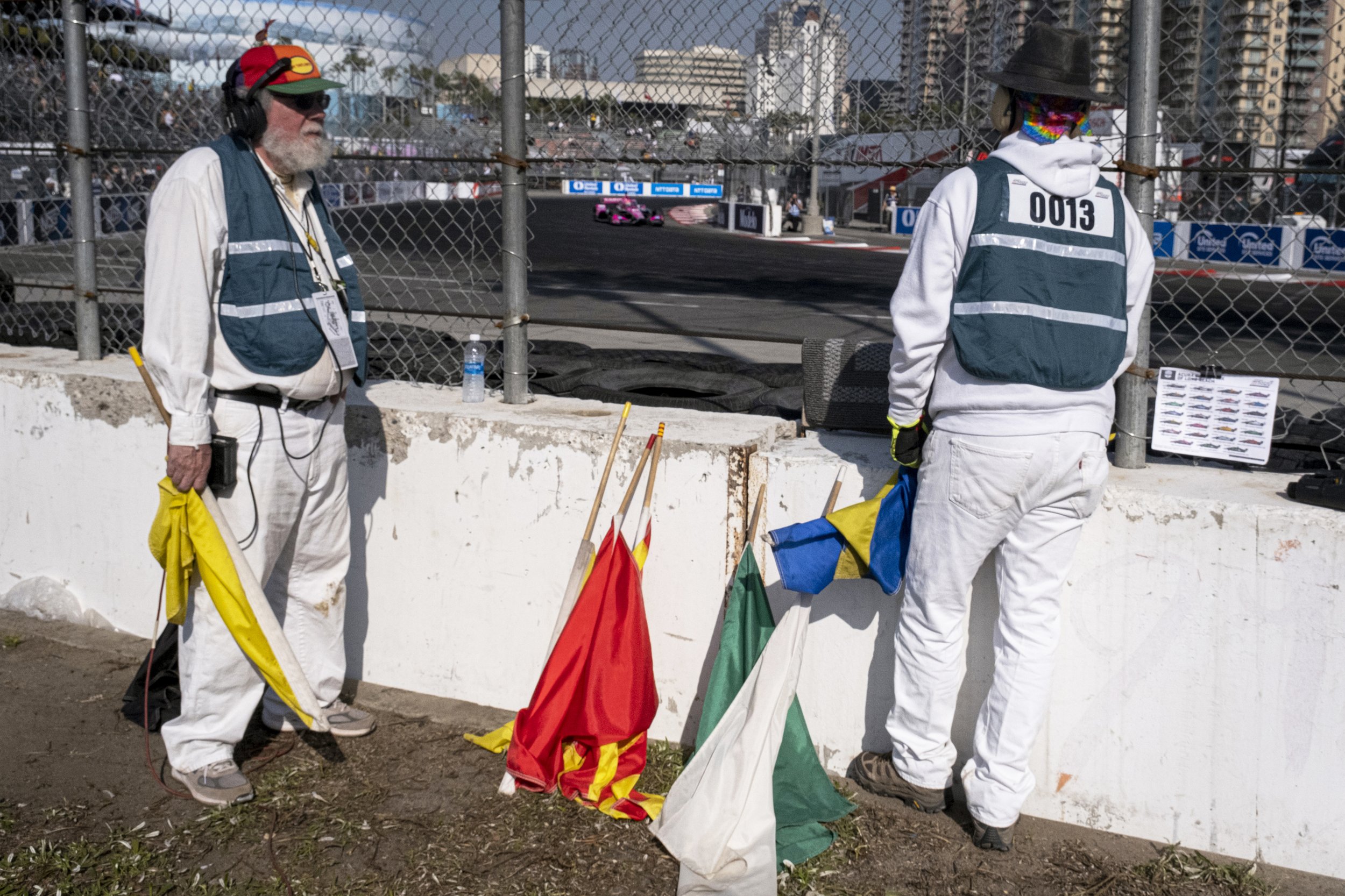  Racing marshals watch the race, and stand by flags which colors corrospond and signal different conditions. 48th Annual Acura Grand Prix in Long Beach, Calif. on Sat., April 15, 2023. (Anna Sophia Moltke | The Corsair) 