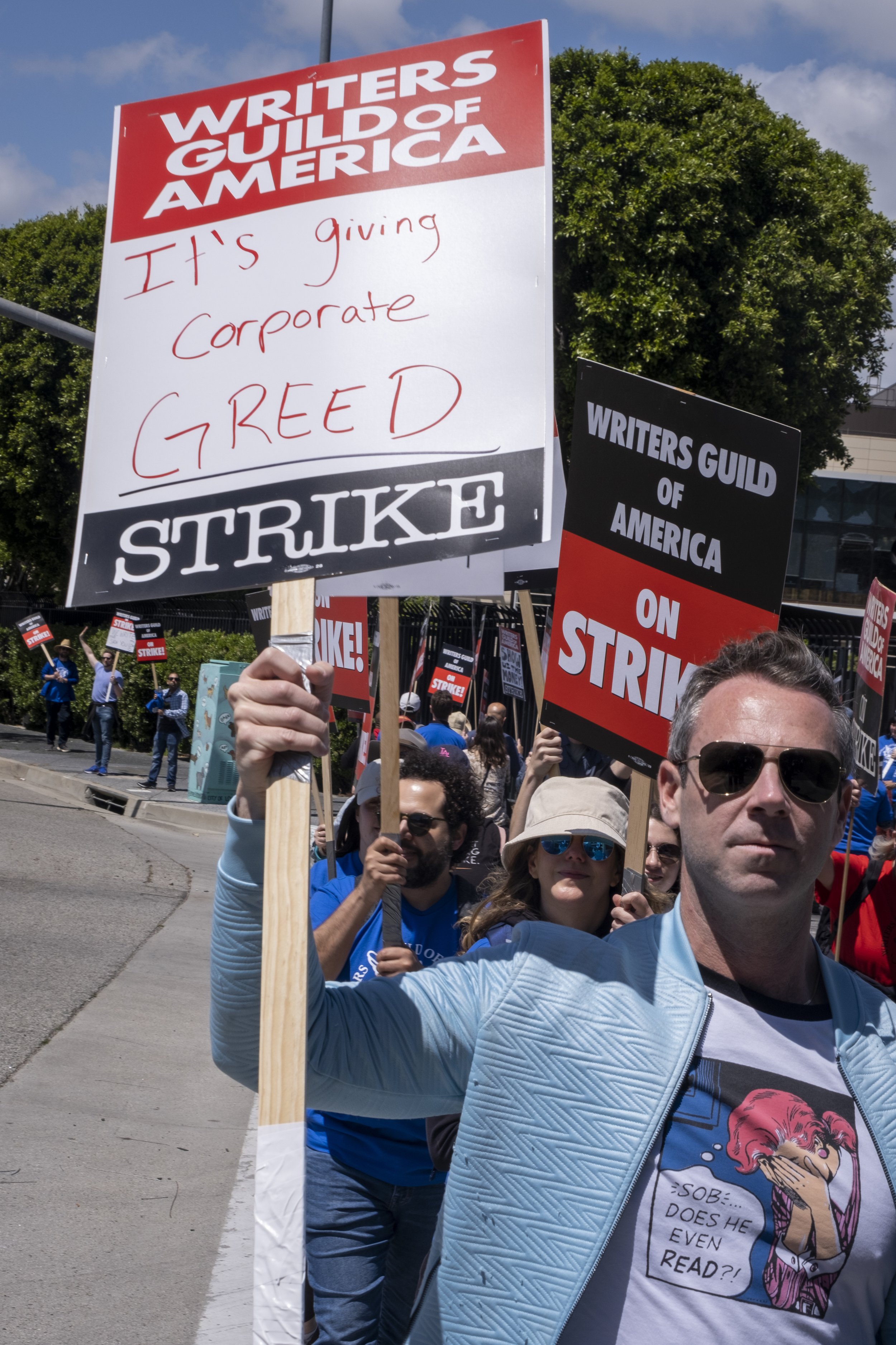  Writers Guild of America members picket in front of Universal Studios in Studio City, Calif. on Tuesday, May 2 following disagreements within negotiations between the Alliance of Motion Pictures and Television Producers. (Anna Sophia Moltke | The Co