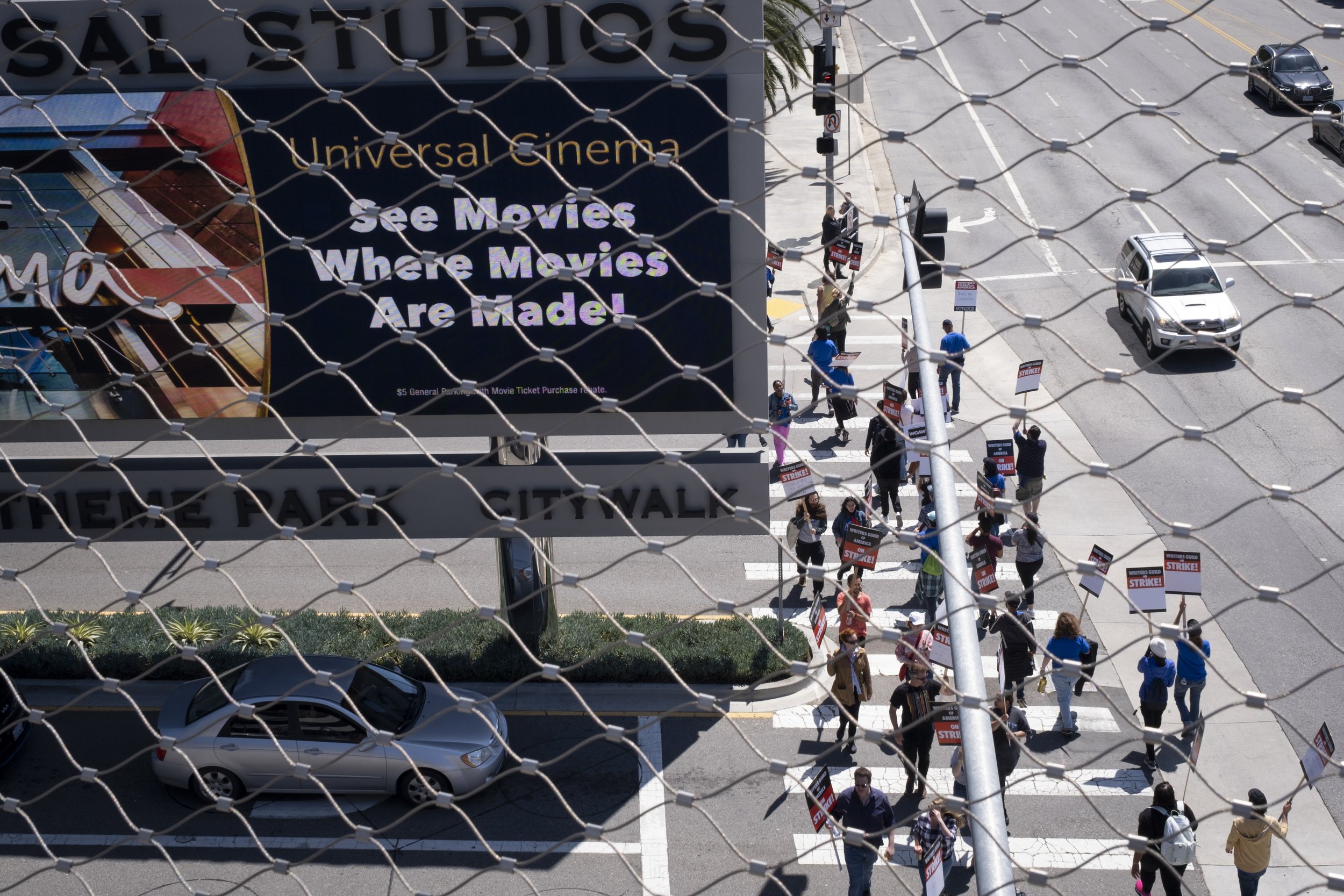  Writers Guild of America members picket in front of Universal Studios in Studio City, Calif. on Tuesday, May 2 following disagreements within negotiations between the Alliance of Motion Pictures and Television Producers. (Anna Sophia Moltke | The Co