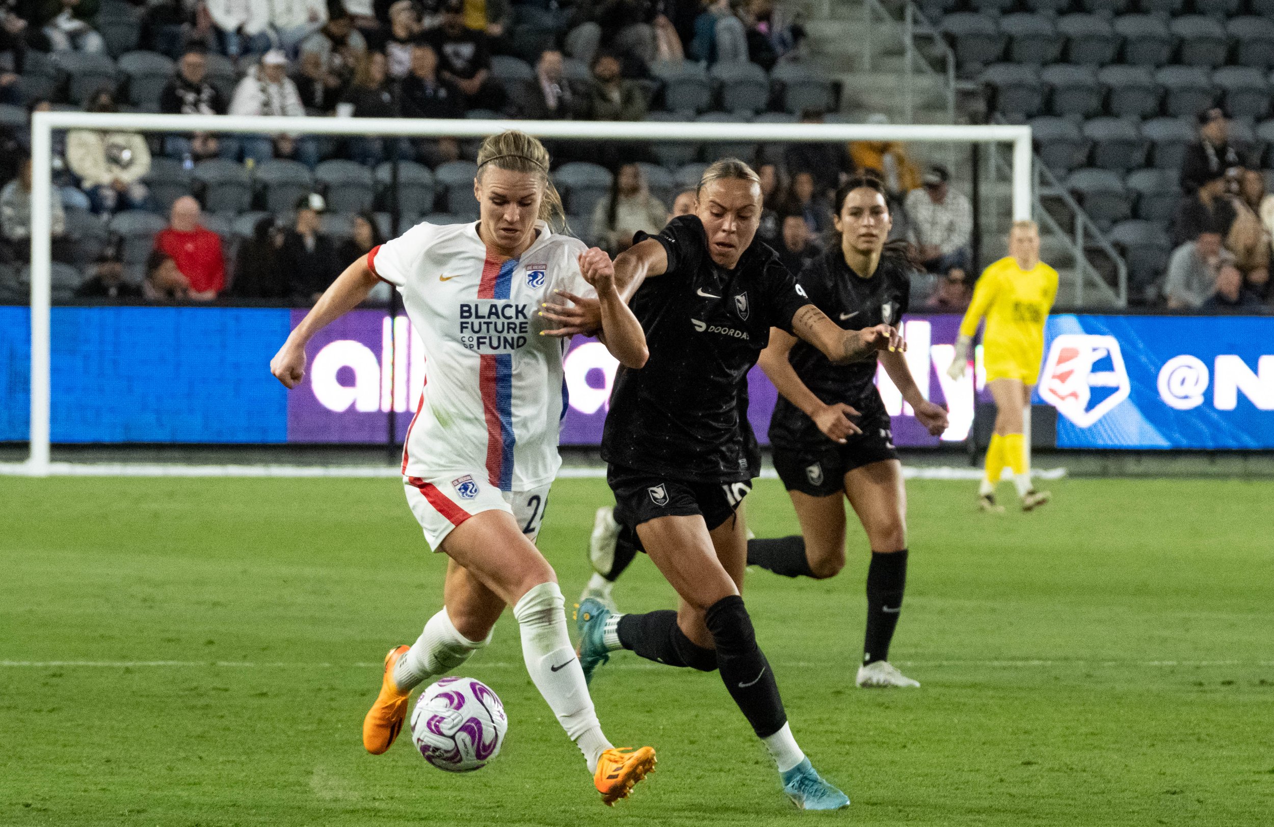  OL Reign Forward Veronica Latsko keeping the ball away from Angel City FC defender Mary Alice Vignola(R) during their match on Wednesday, April 19, 2023 in BMO Stadium at Los Angeles, Calif. (Danilo Perez | The Corsair) 