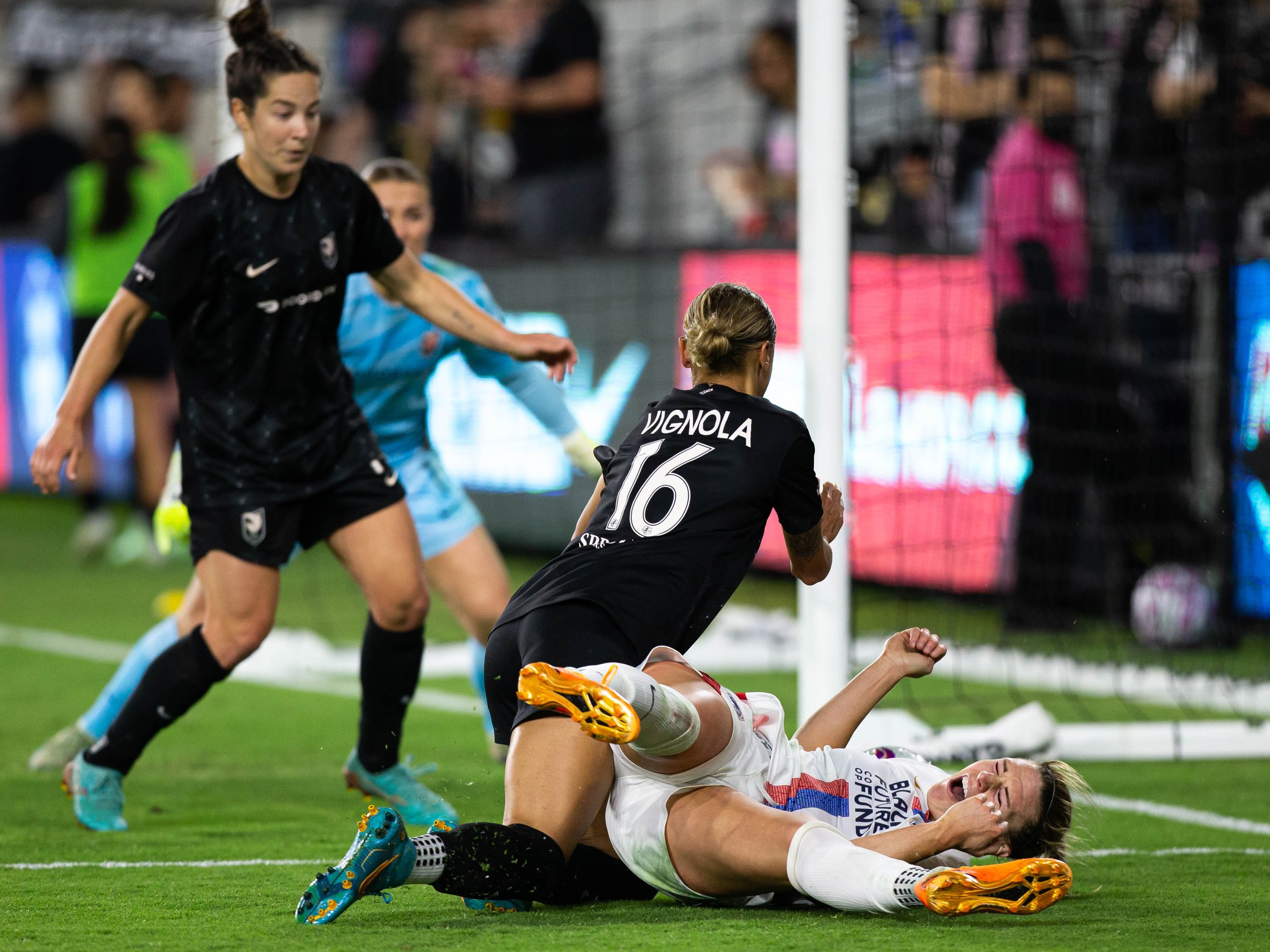  Angel City FC defender Mary Alice Vignola(L) falling on top of OL Reign forward Veonica Latsko(R) during their NWSL Challenge Cup on Wednesday, April 19, 2023 in BMO Stadium at Los Angeles, Calif. (Danilo Perez | The Corsair) 